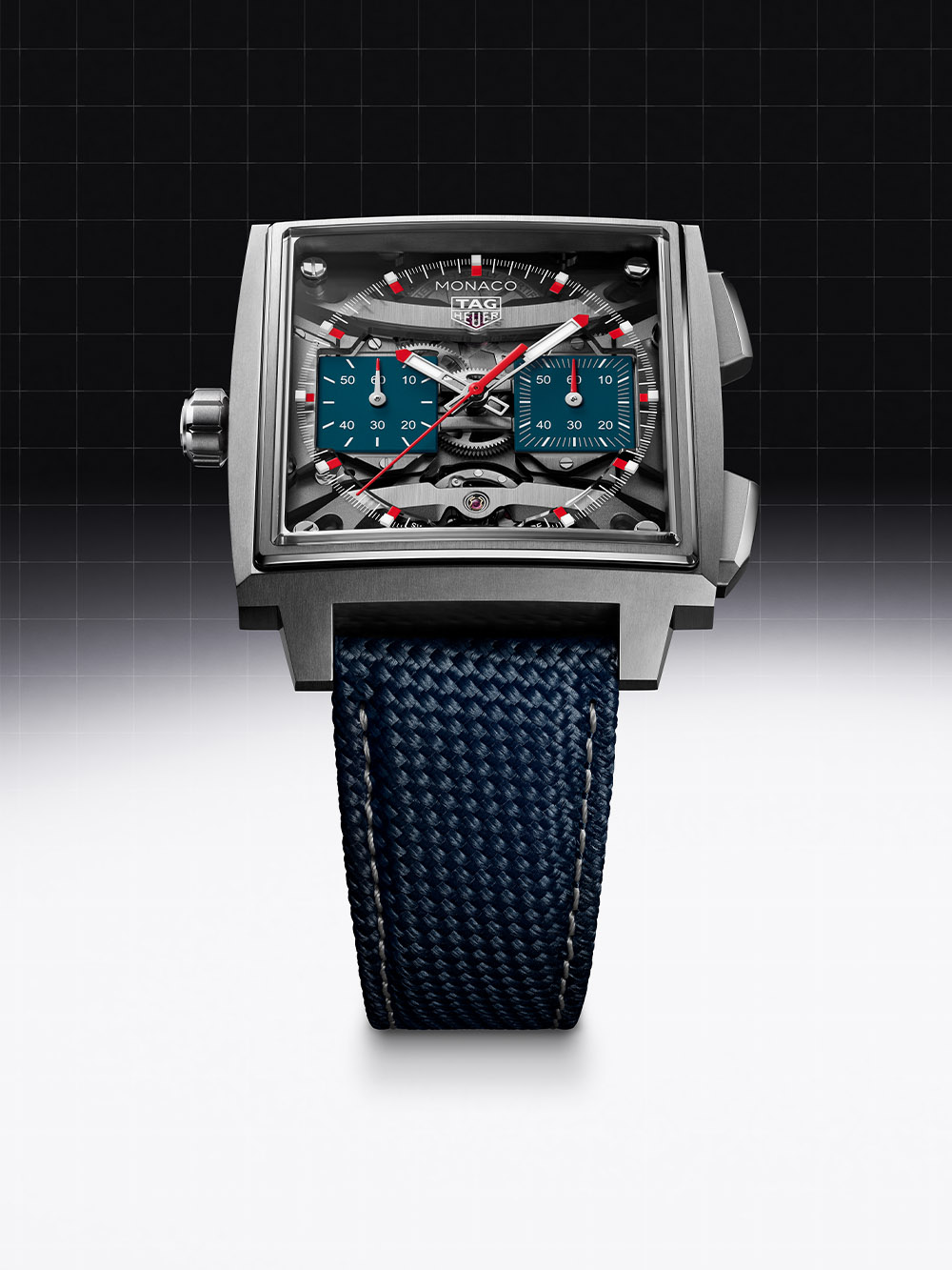 Monaco Evergraph CEW5181.FT8123 front view, 40mm square titanium case, skeletonised dial exposing the compliant-mechanism structures beneath the chronograph hands, two blue opaline counters at 3 and 9, crown on the left side of the case