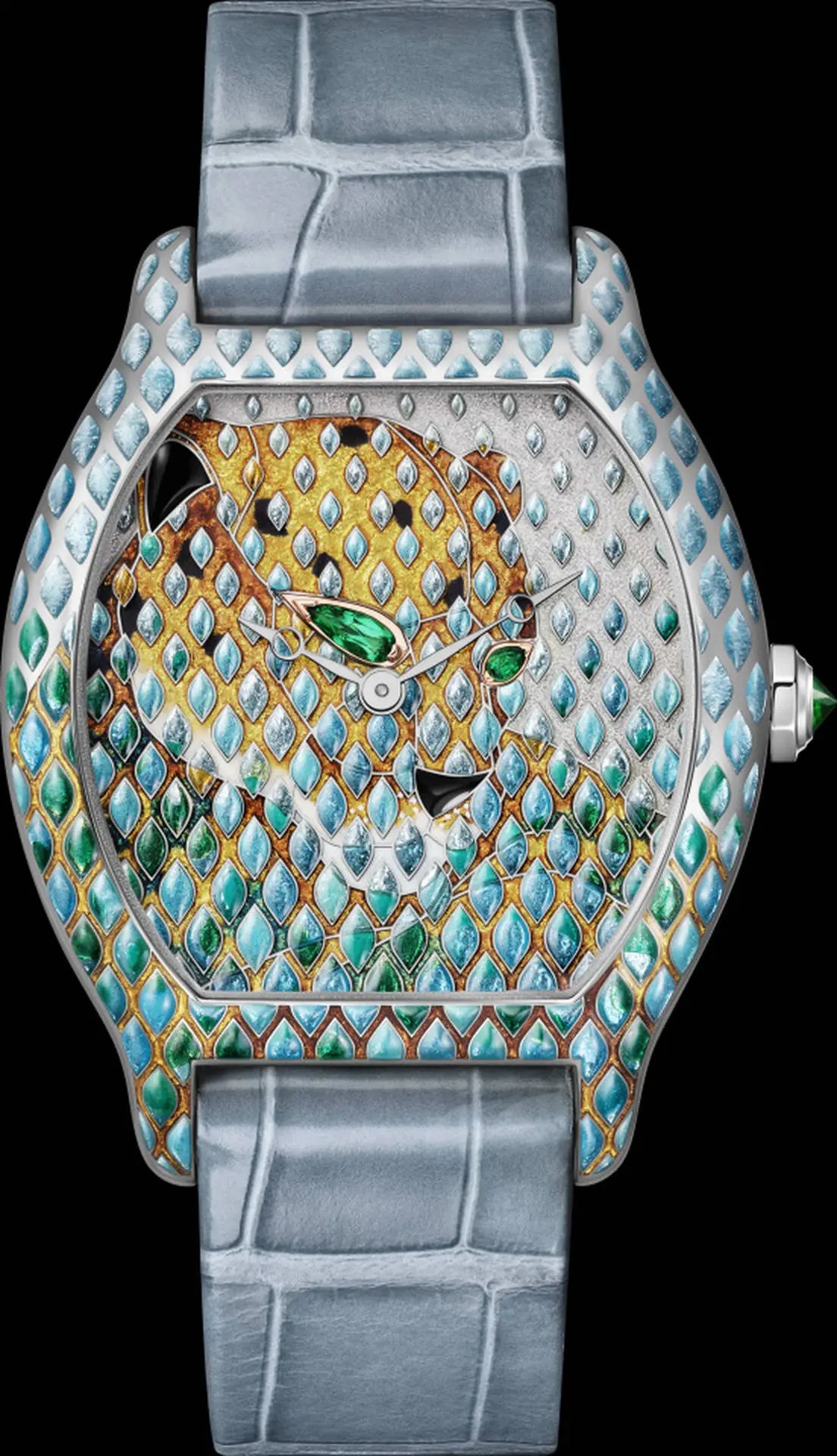 Close-up of the Panthère Métiers d'Art Tortue reference CRHPI01811 in white gold, champlevé enamel scales in blue and ochre depicting the panther's coat across dial and case middle, with tsavorite eyes