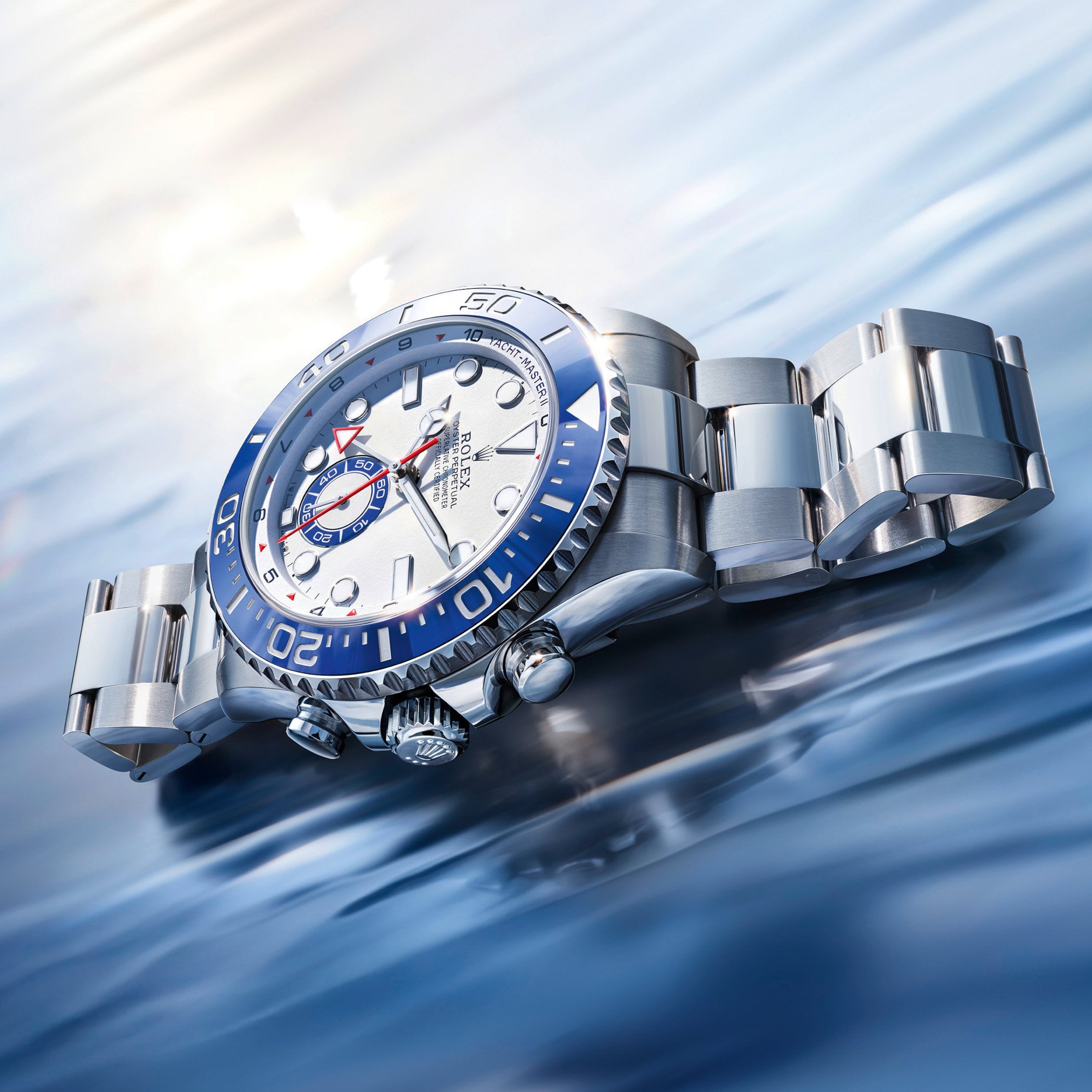 Reference 126680 in Oystersteel photographed at an angled three-quarter view on water, with the Cerachrom bezel, the two case pushers, and the Oyster bracelet visible