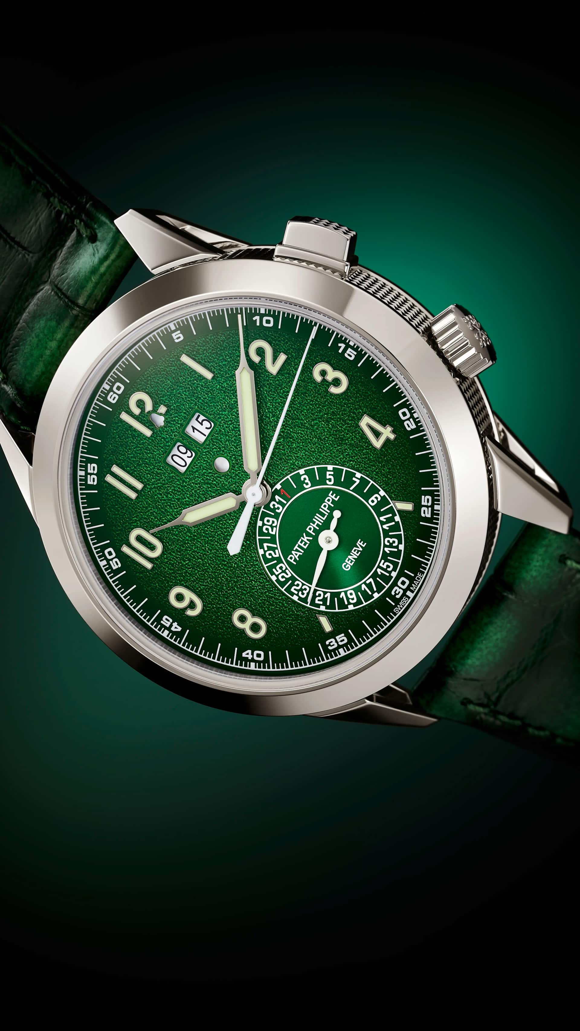 Patek Philippe Calatrava Alarme 24-hour reference 5322G-010 in 18-karat white gold, 41mm case with hobnail caseband and single pusher at 2 o'clock, green grainy gradient dial with applied white gold Arabic numerals, double alarm-time aperture and bell-shaped day/night indicator beneath 12, small date sub-dial with PATEK PHILIPPE GENEVE signature, green alligator strap