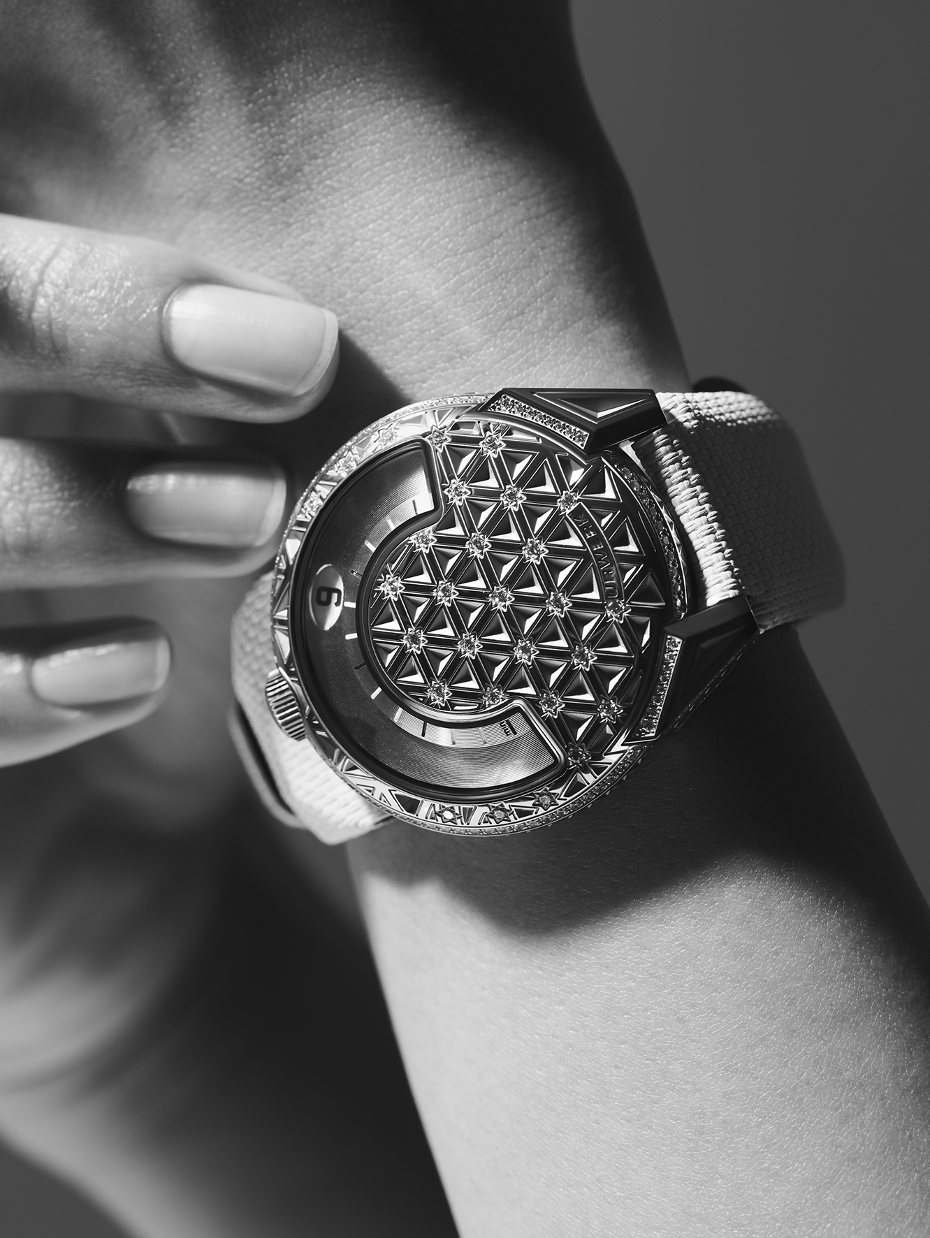 UR-101 Diamond Sky on the wrist, diamond-pavé bezel and dome catching the light, blue hour indicator visible on the wandering satellite