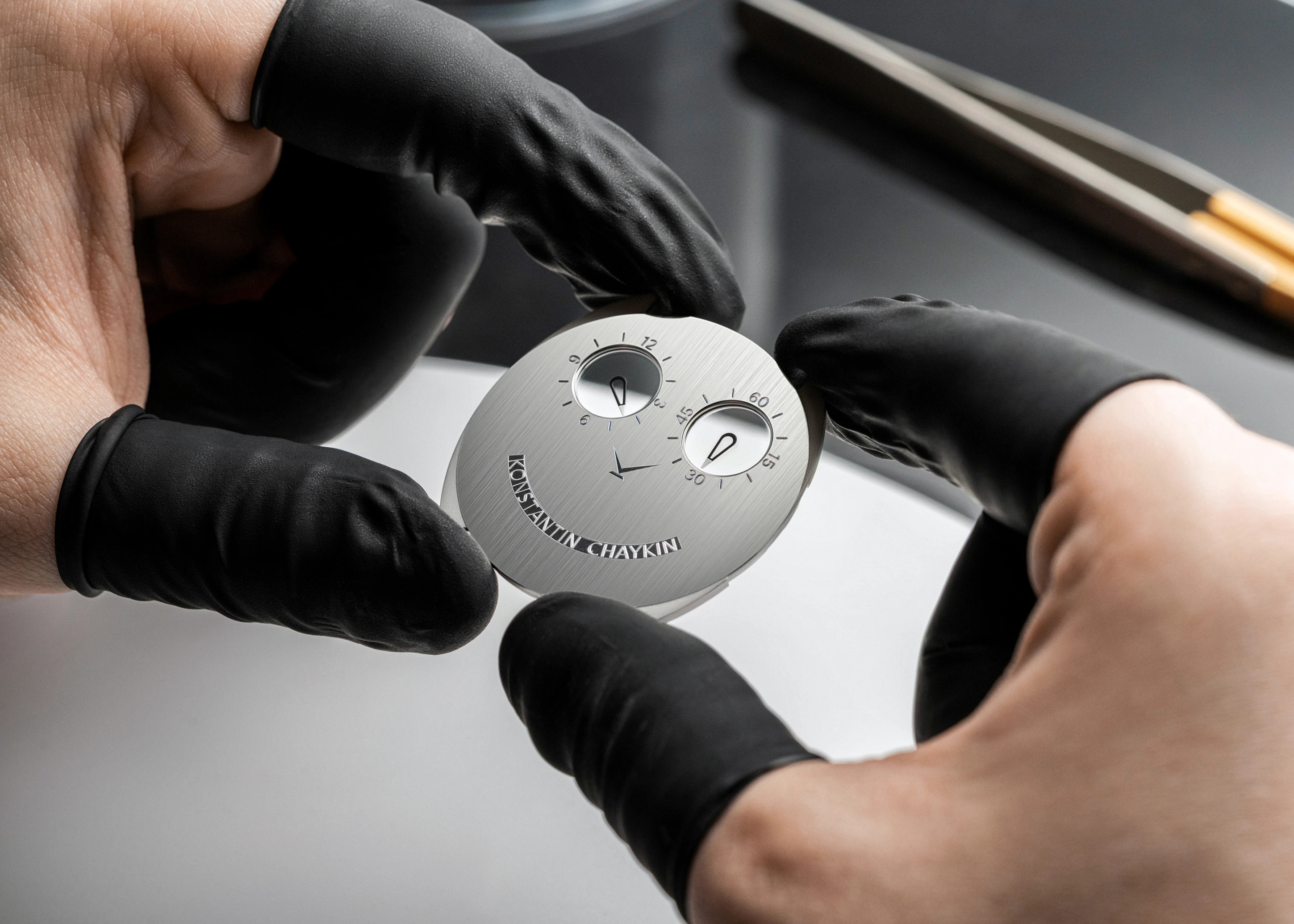 ThinKing Mystery shown edge-on against a ruler, demonstrating the 1.65mm height of the case from sapphire crystal to caseback