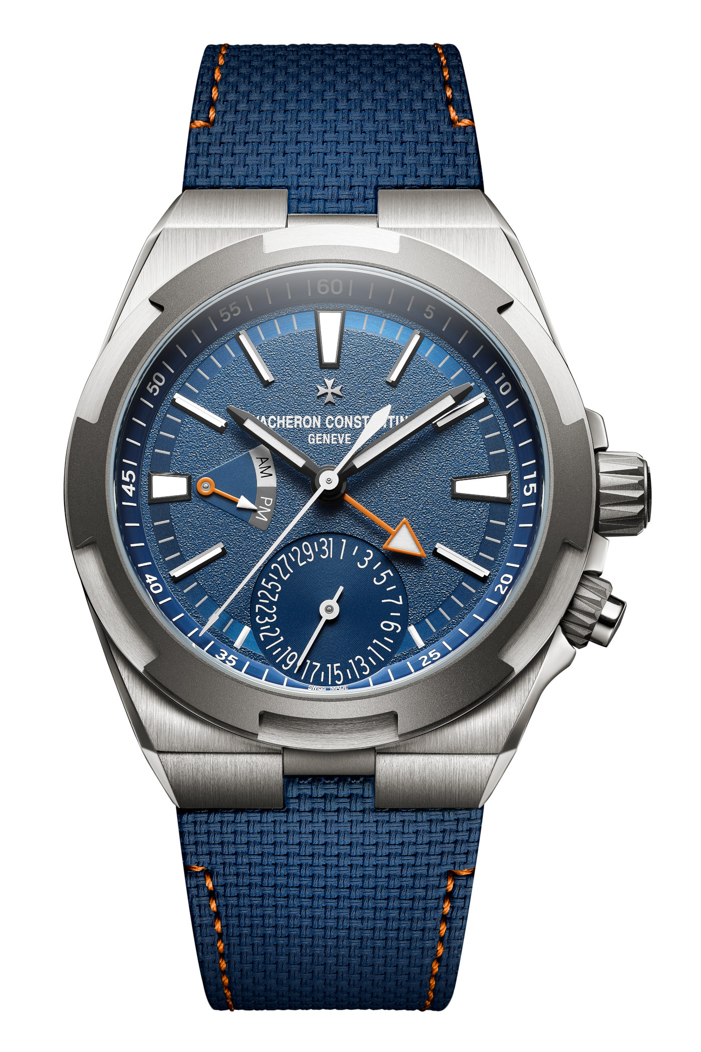 Overseas Dual Time Cardinal Points North reference in titanium with white sunburst dial, applied Maltese cross at 12, second time zone via central GMT hand, day/night indicator at 9 and pointer date around the periphery