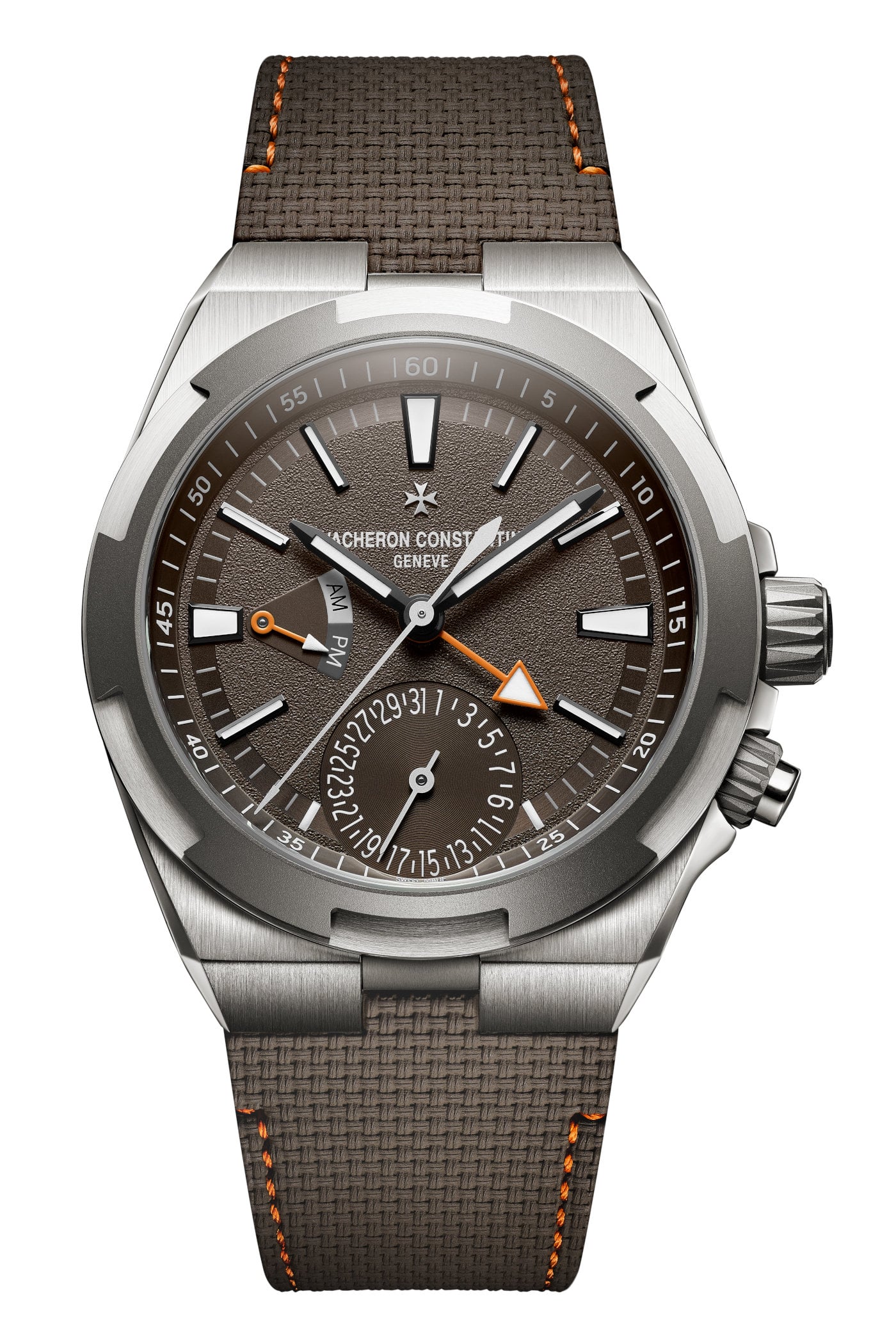 Overseas Dual Time Cardinal Points South reference, brown sunburst dial with wind rose guilloché pattern in the centre, photographed against terracotta-toned ground