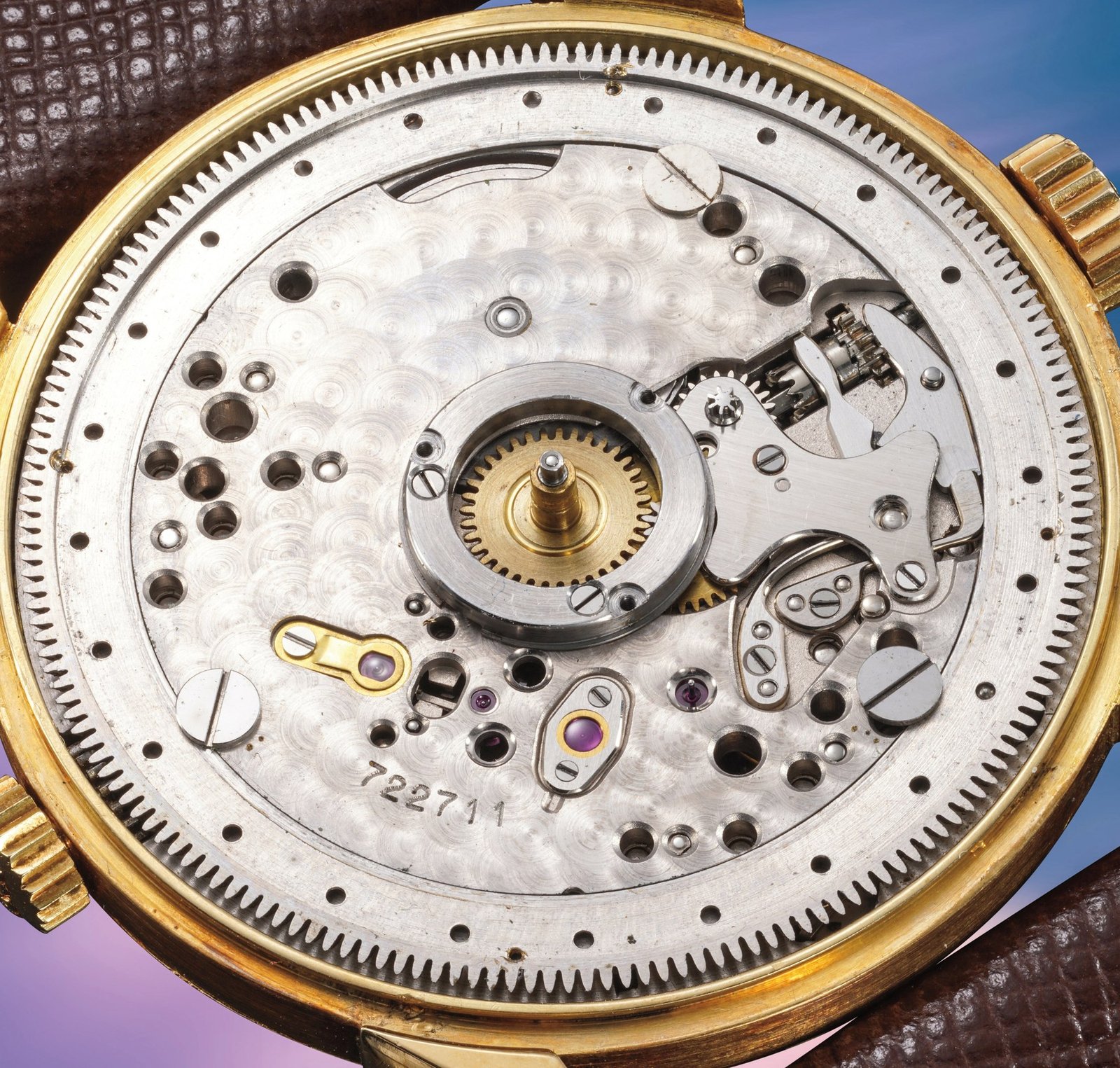 Patek Philippe caliber 12 ligne 400 HU manual world-time movement under sapphire, eighteen jewels, with the world-time city ring driving wheel visible at the upper right and the movement number 722'711 stamped on the mainplate