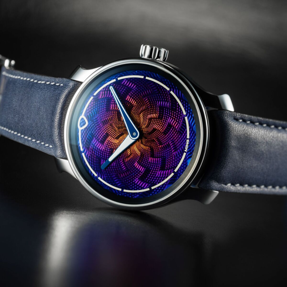 Low-angle view of the 37.06 Lightning showing the notched crown, the pagoda-style lugs of the Ming 37-series case and the blue calfskin strap