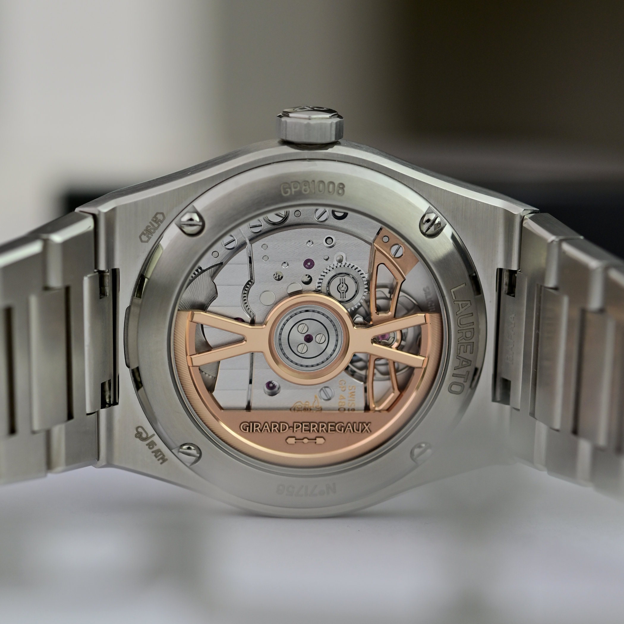 Caseback of the Laureato Fifty showing the calibre GP4800 through sapphire, with the rose gold balance bridge, Geneva stripes and the GP81008 engraving on the steel ring
