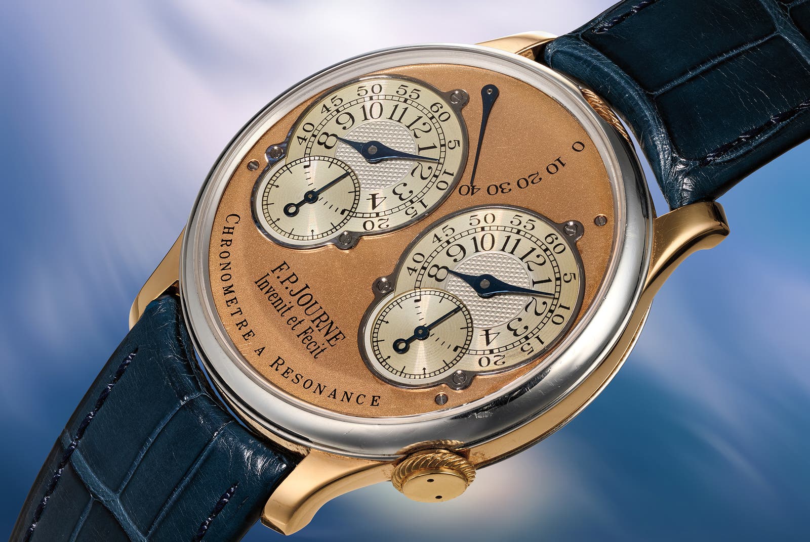 F.P. Journe Chronomètre à Résonance 'Souscription, No. 007' at a three-quarter angle, platinum and pink gold case on a dark blue crocodile strap, pink gold dial with two silvered guilloché subsidiary dials and the F.P.Journe Invenit et Fecit signature