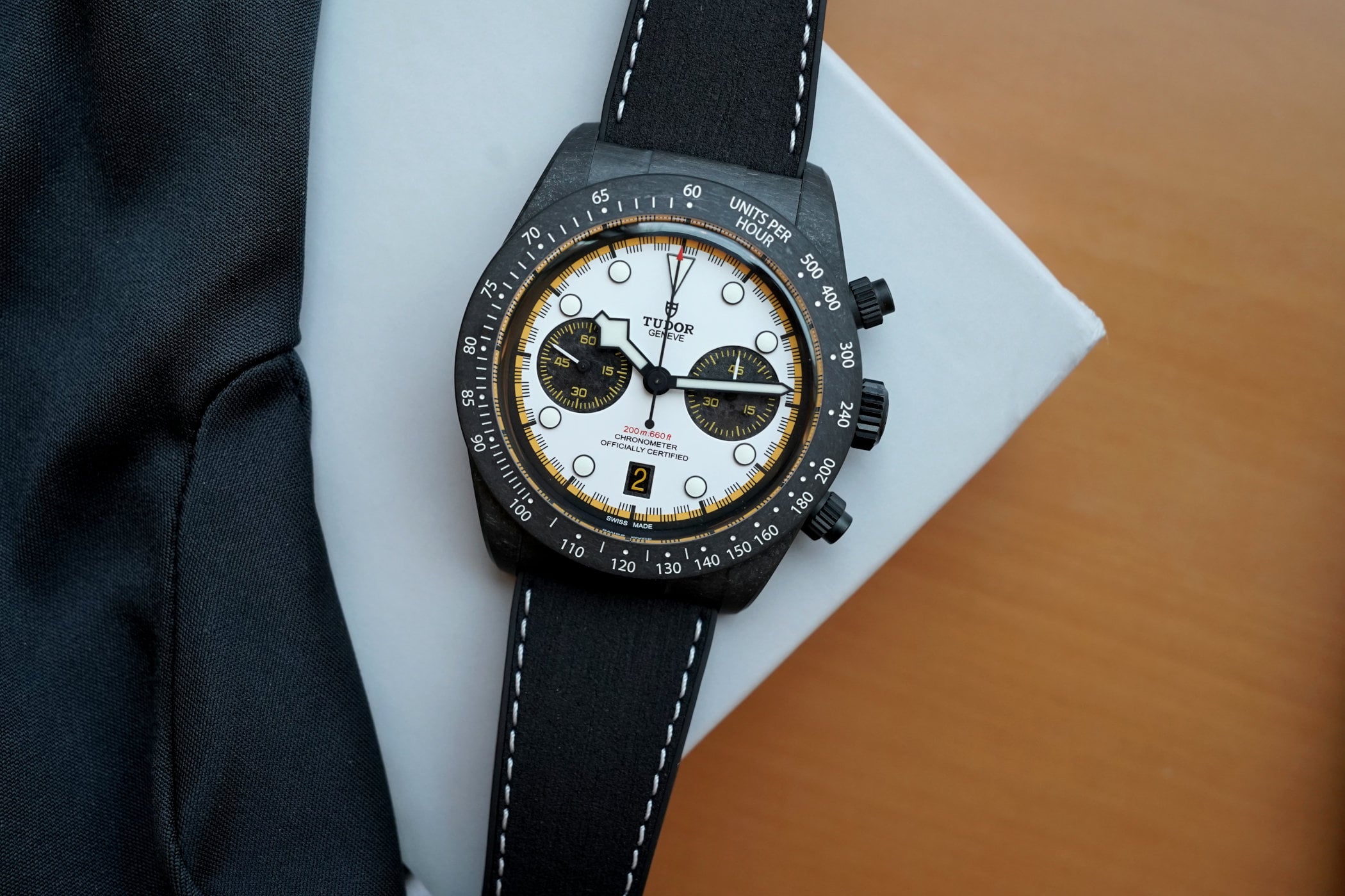 Tudor Black Bay Chrono Carbon 26 reference M79377KN-0003, marbled carbon-fibre 42mm case and tachymeter bezel, racing-white dial with two black carbon-fibre sub-counters, yellow minute track and accents, yellow date window at six, blackened snowflake hands, on a black tyre-pattern leather-rubber strap