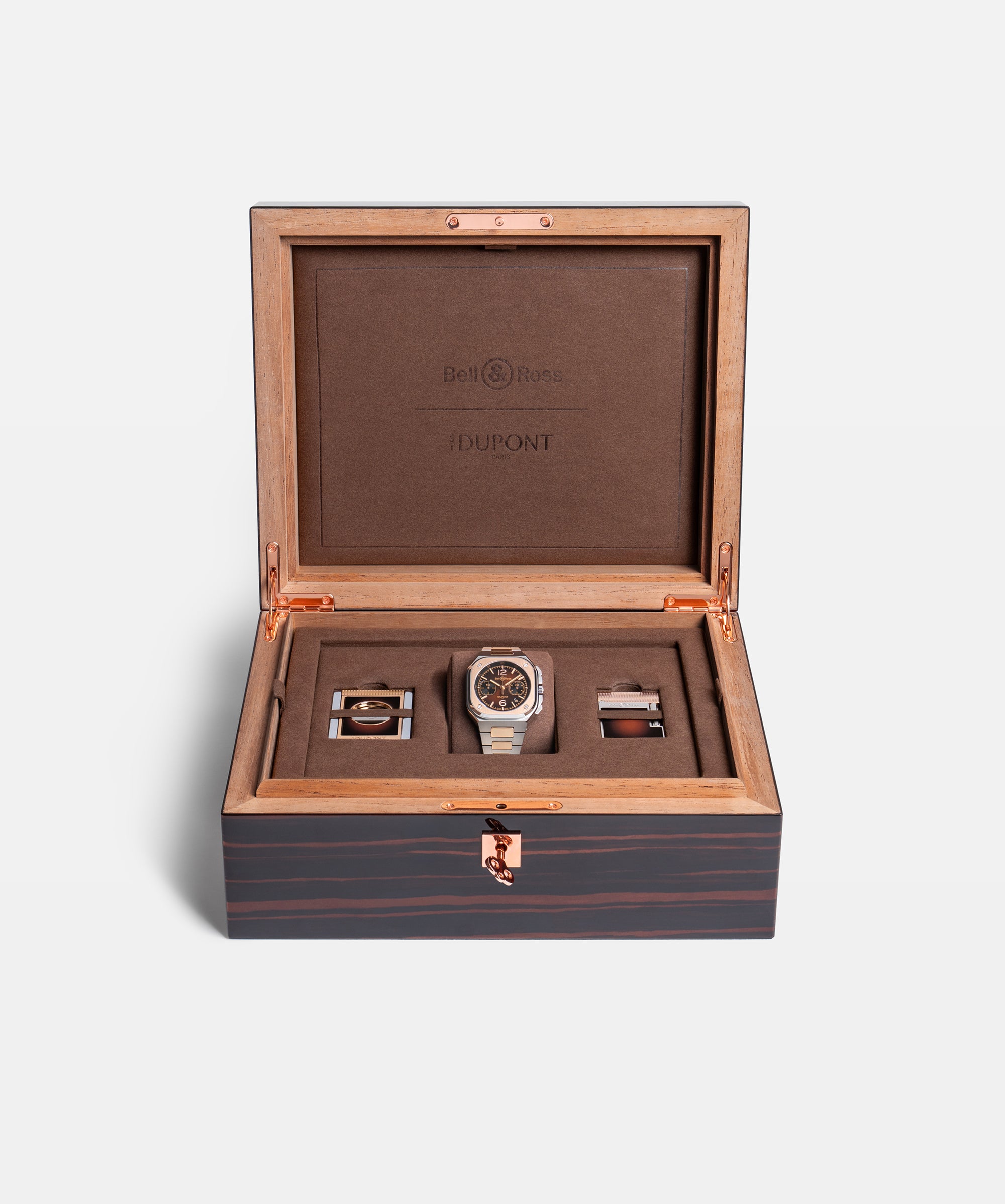 Profile of the watch lying on its bracelet, brown dial and rose gold bezel seen at a low angle with the steel and rose gold links and the crown and chronograph pushers