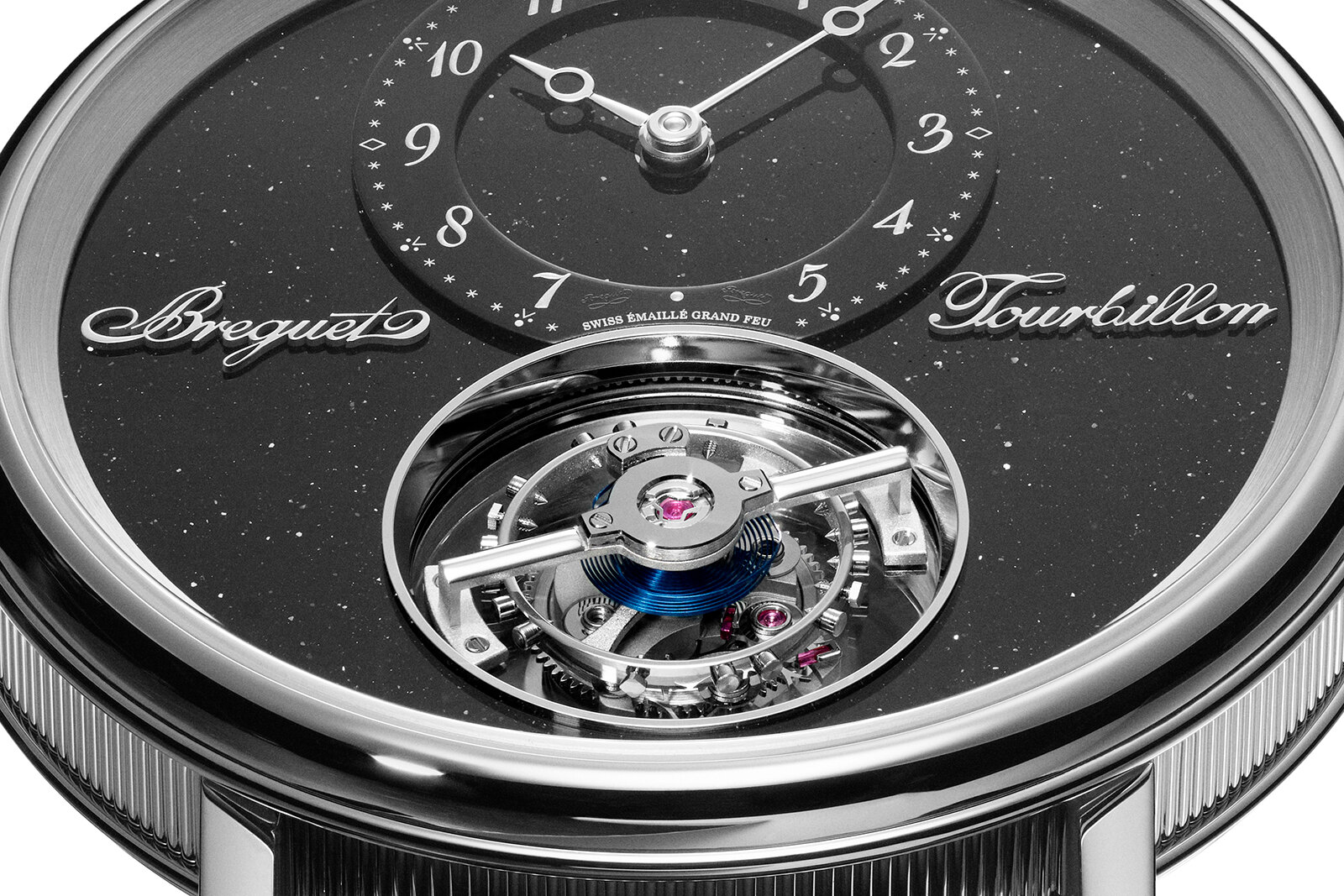 Dial macro of the Breguet Classique Tourbillon Sideral 7255PT, a black aventurine grand feu enamel dial flecked with copper, an off-centre hours chapter ring with Breguet numerals and an exposed flying tourbillon at six o'clock