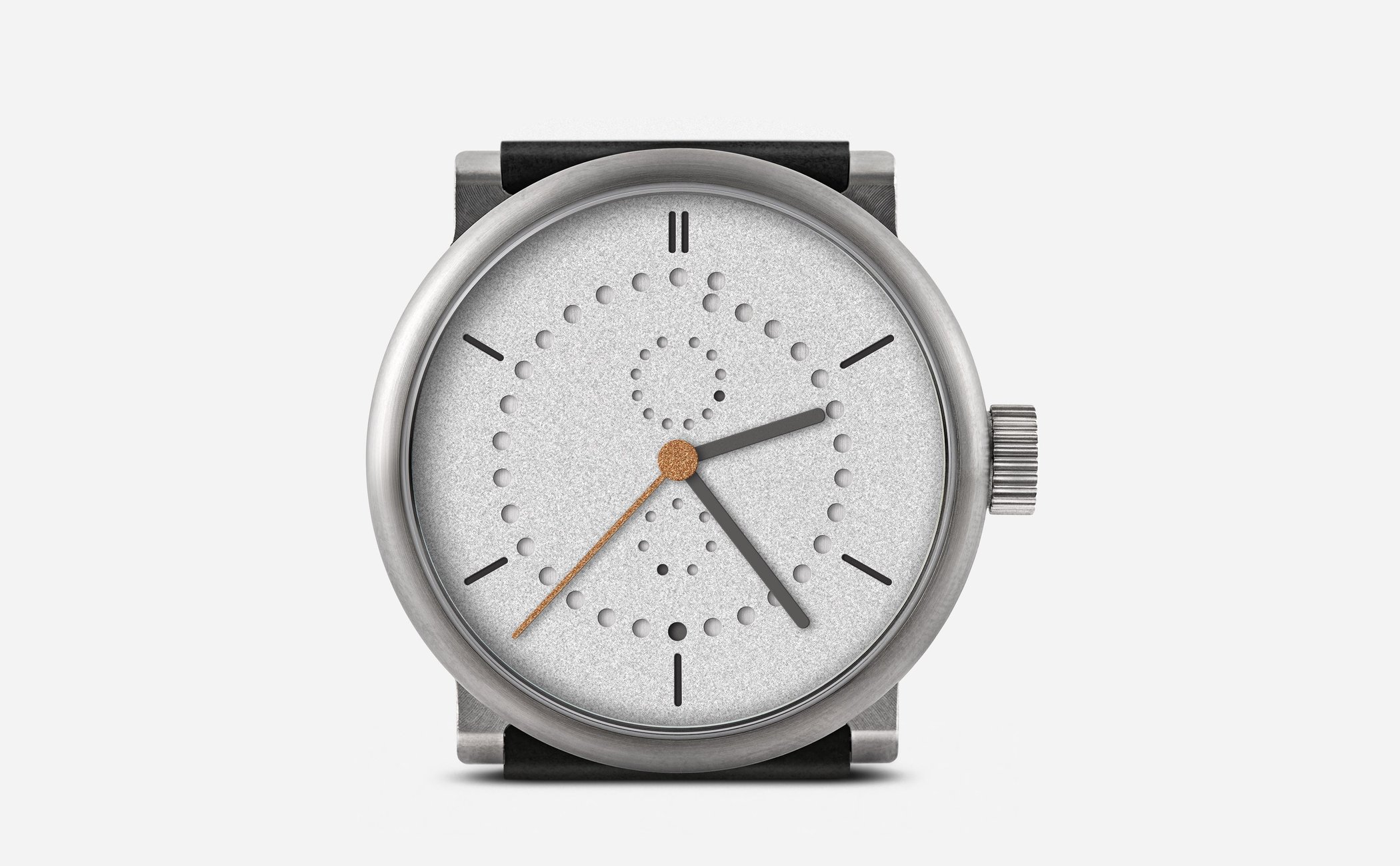 Straight-on view of the Ochs und Junior Anno Sandblasted 39mm, grade 5 titanium case with visible machining on the lug blocks, sandblasted grey dial with date, month and weekday holes, double index at 12 and gold-leaf seconds hand