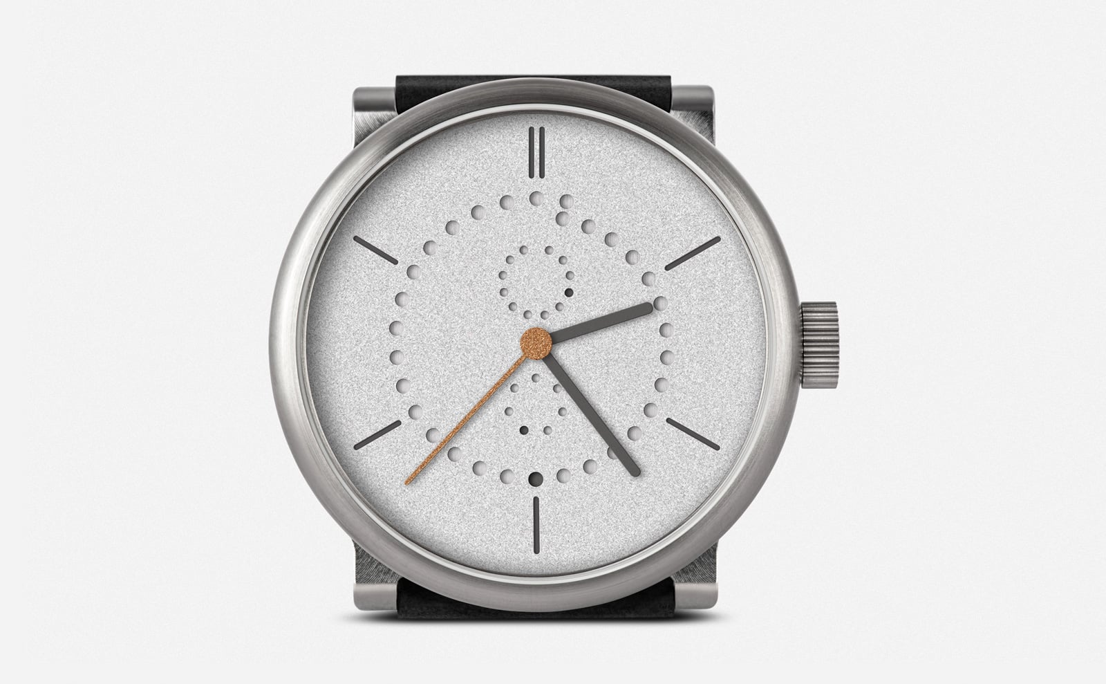 Ochs und Junior Anno Sandblasted 42mm front view, two-part grade 5 titanium case with fluted screw-down crown at 3, sandblasted rhodium-plated dial with perforated calendar rings, black leather strap