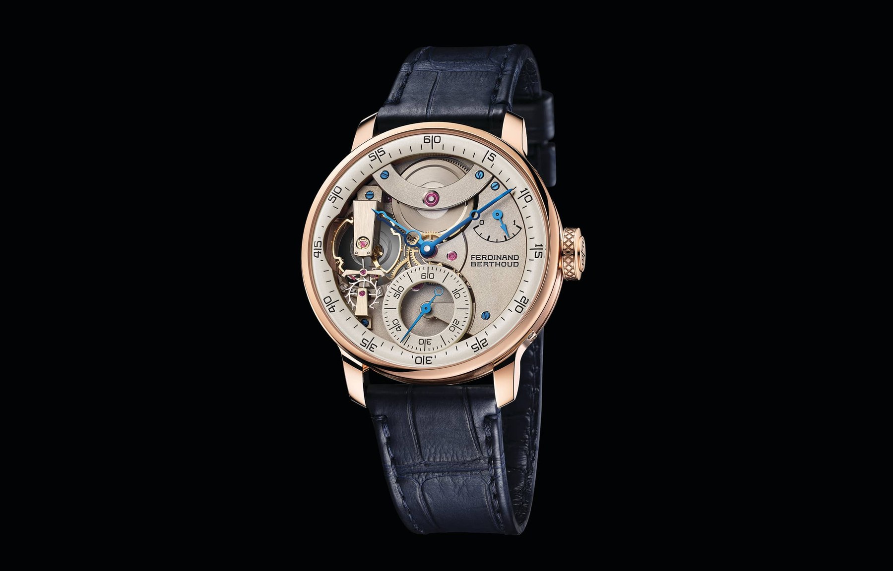 Three-quarter view of the FB 3SPC.2-1 on black, rose gold case and fluted crown, openworked movement dial with beige peripheral ring, blue alligator strap