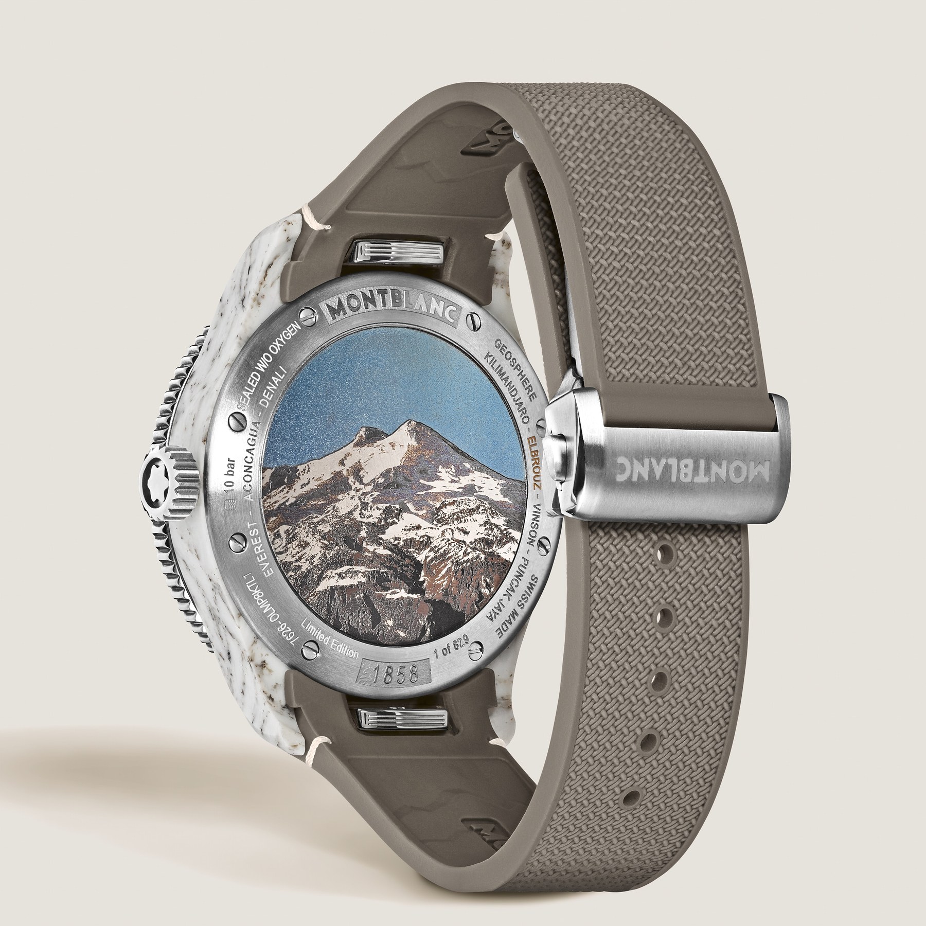 Titanium caseback of ref. 136353 with a colour laser engraving of the snow-covered twin summits of Mount Elbrus under a blue sky, the surrounding ring engraved with the names of the Seven Summits and marked 1 of 829 and 1858
