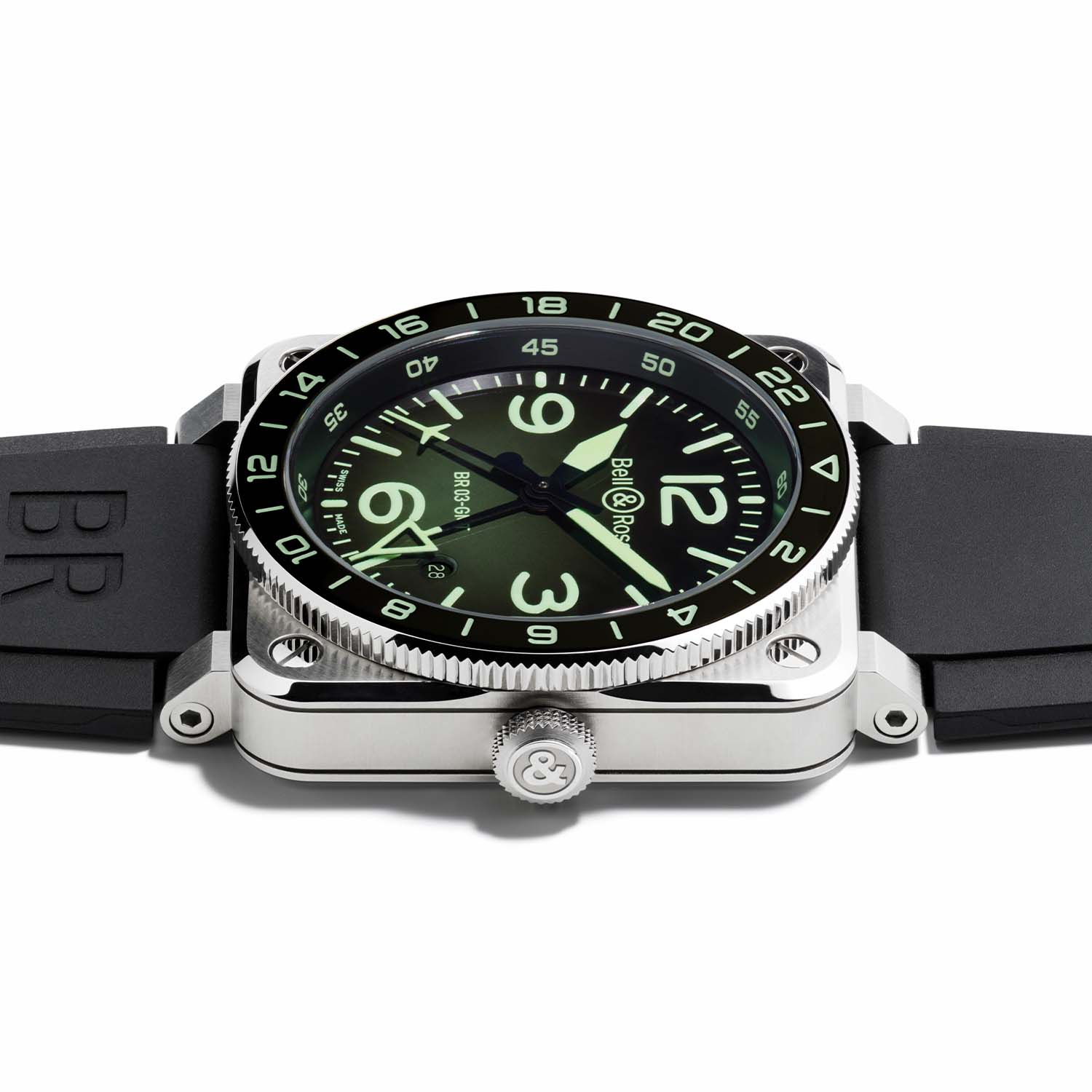 Straight-on view of the Bell & Ross BR-03 GMT Green Lum, green-to-black gradient dial, pale green Super-LumiNova numerals and markers, blackened hour and minute hands, an openworked triangular 24-hour GMT hand near six o'clock and a date window at 4:30, under a black bezel with a 24-hour scale