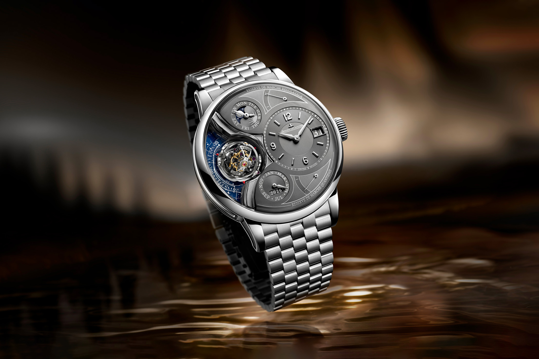 Jaeger-LeCoultre Duometre Heliotourbillon Perpetual ref. Q6206150, polished platinum case on a five-row platinum bracelet, grey dial with a triple-axis tourbillon exposed at nine o'clock against a blue starry background, day and moon phase sub-dial above, month and 2026 year indication below, big date at three