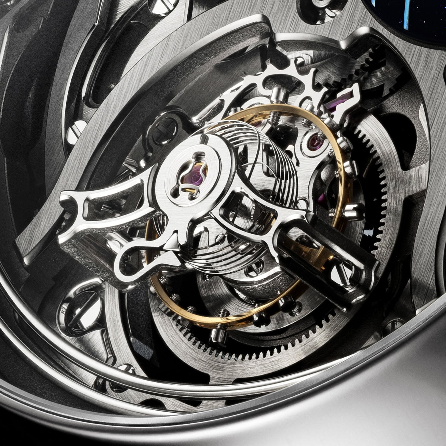Close view of the one-minute flying tourbillon and its cylindrical hairspring rising around the balance staff among the hand-finished skeletonised bridges of the HMC 909