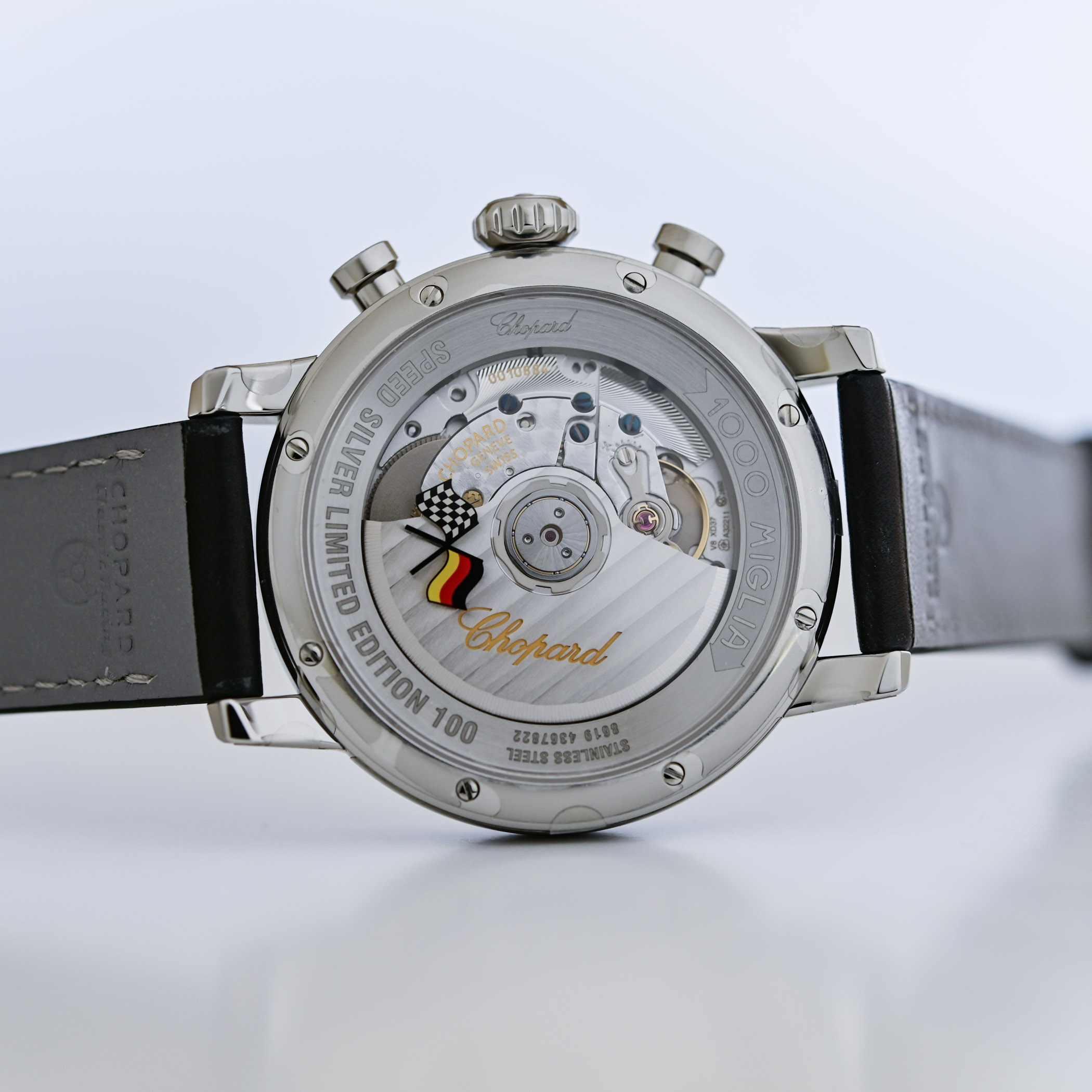 Caseback of the German Speed Silver edition, engraved SPEED SILVER LIMITED EDITION 100 and 1000 MIGLIA around a sapphire showing the movement, with a chequered flag crossed with the German flag
