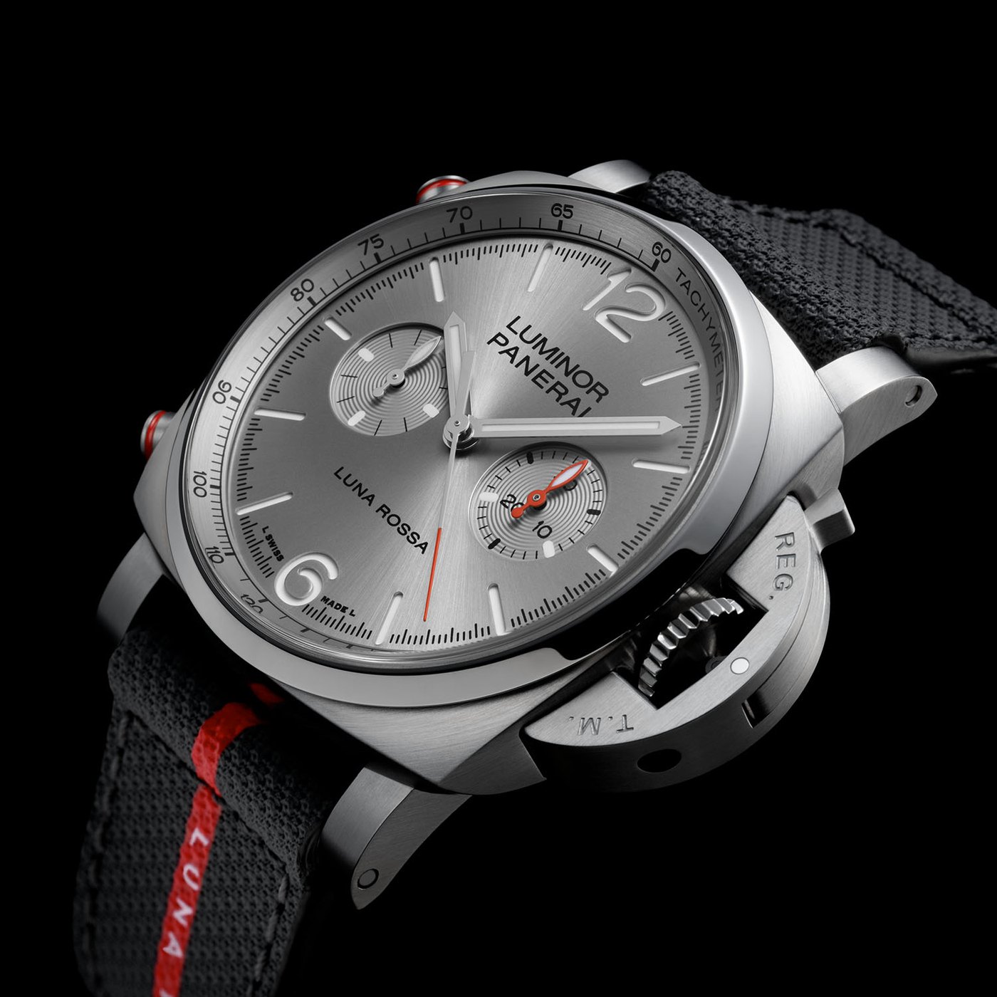 The sibling Luminor Luna Rossa Chrono PAM01768 in steel on a black textile strap with a red Luna Rossa stripe, silver dial with two chronograph sub-dials and a tachymeter scale on the flange
