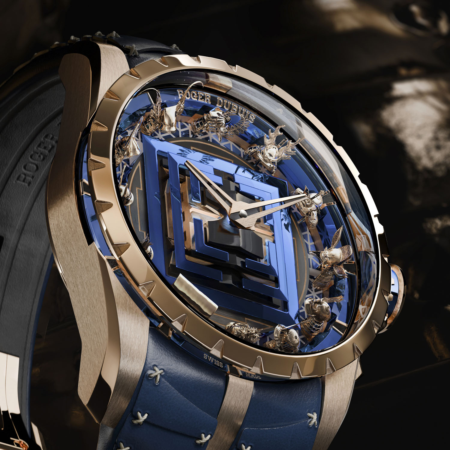 Dial macro of the Roger Dubuis Excalibur Kabuto Legacy RDDBEX1139 showing the stepped blue and gold Edo Castle at the centre, the surrounding gold kabuto helmets and the SWISS MADE flange under the sapphire