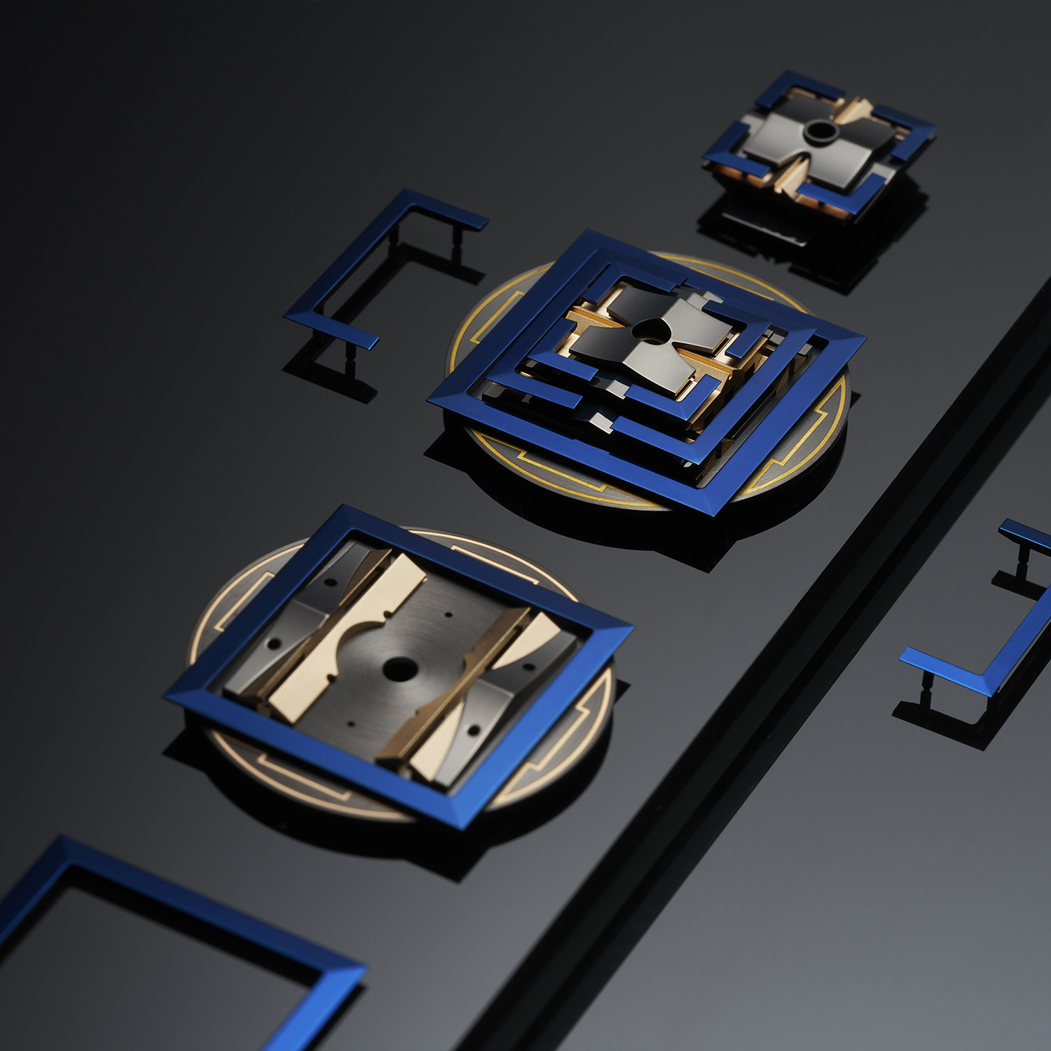 The 17 pink gold, black PVD and blue CVD components of the abstract Edo Castle laid out separately before assembly, each disc engraved with a samurai crest