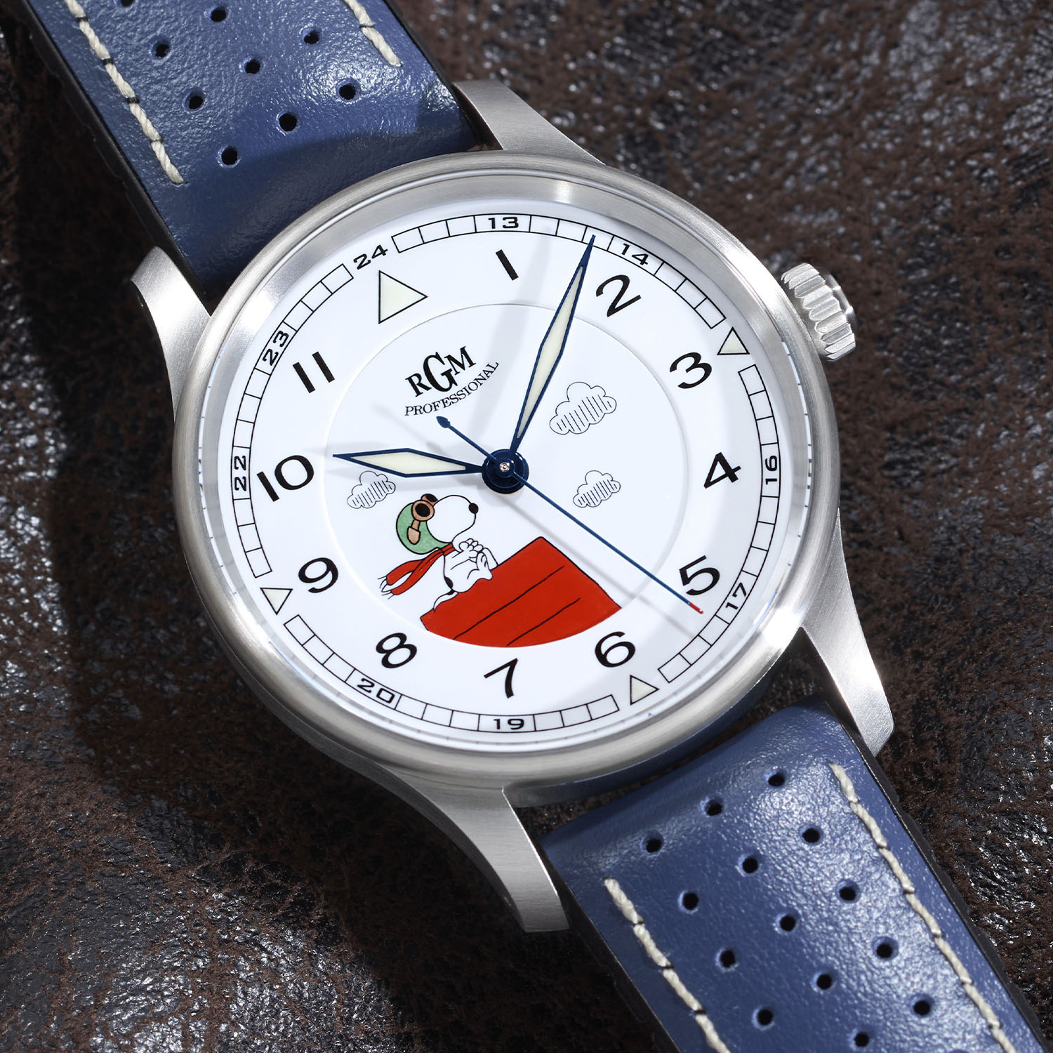 RGM Model 151 Snoopy Flying Ace with the white grand feu enamel dial, Snoopy in goggles on his red doghouse among printed clouds, luminous blue sword hands and printed Arabic numerals, on a blue perforated leather strap