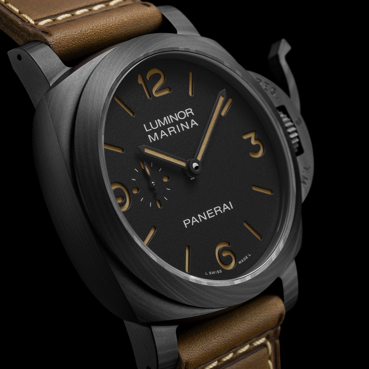 Angled close-up of the PAM01707 showing the marbled matte-black Carbotech case grain and the matte Carbotech crown-protecting bridge