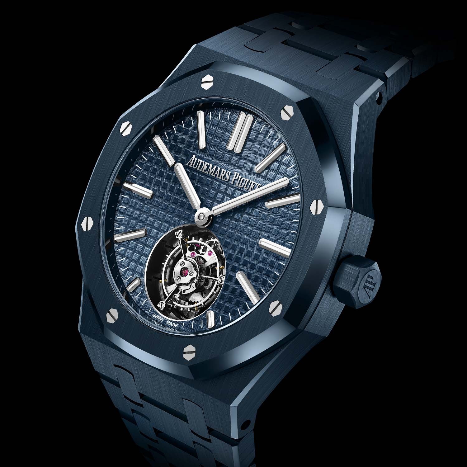 Angled view of the blue ceramic 26730CD showing the flying tourbillon opening at 6 o'clock, the polished bezel screws, brushed case flanks, hexagonal AP crown and the integrated ceramic bracelet