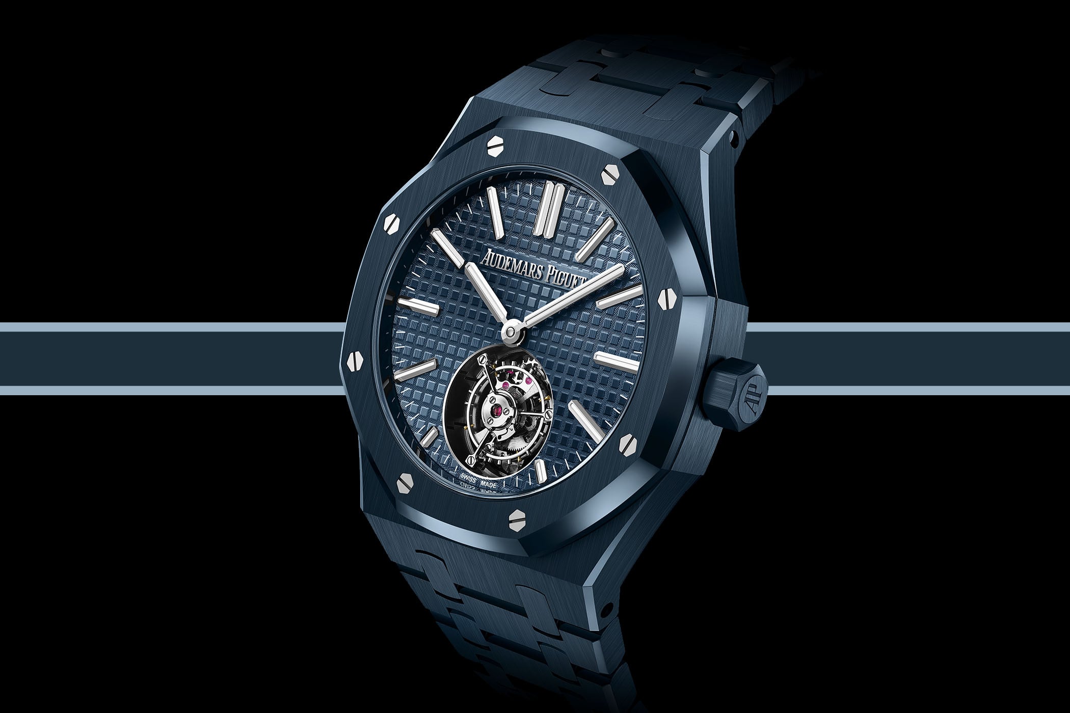 Audemars Piguet Royal Oak Selfwinding Flying Tourbillon 26730CD in Bleu Nuit, Nuage 50 ceramic, deep blue Grande Tapisserie dial with white gold markers, flying tourbillon at 6 o'clock and matching blue ceramic integrated bracelet, shown at a three-quarter angle on a black background
