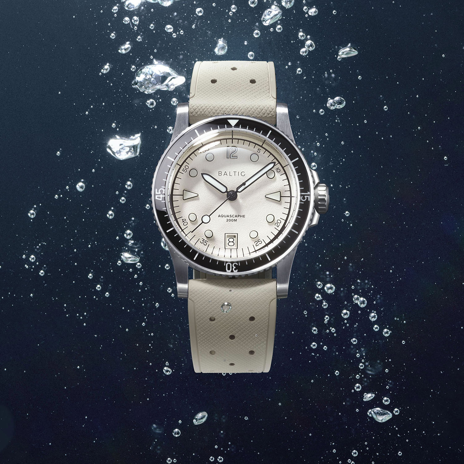 Baltic Aquascaphe MK2 Date with a warm silver grained dial and a contrasting black bezel, the date window at 6 o'clock, on a cream rubber strap