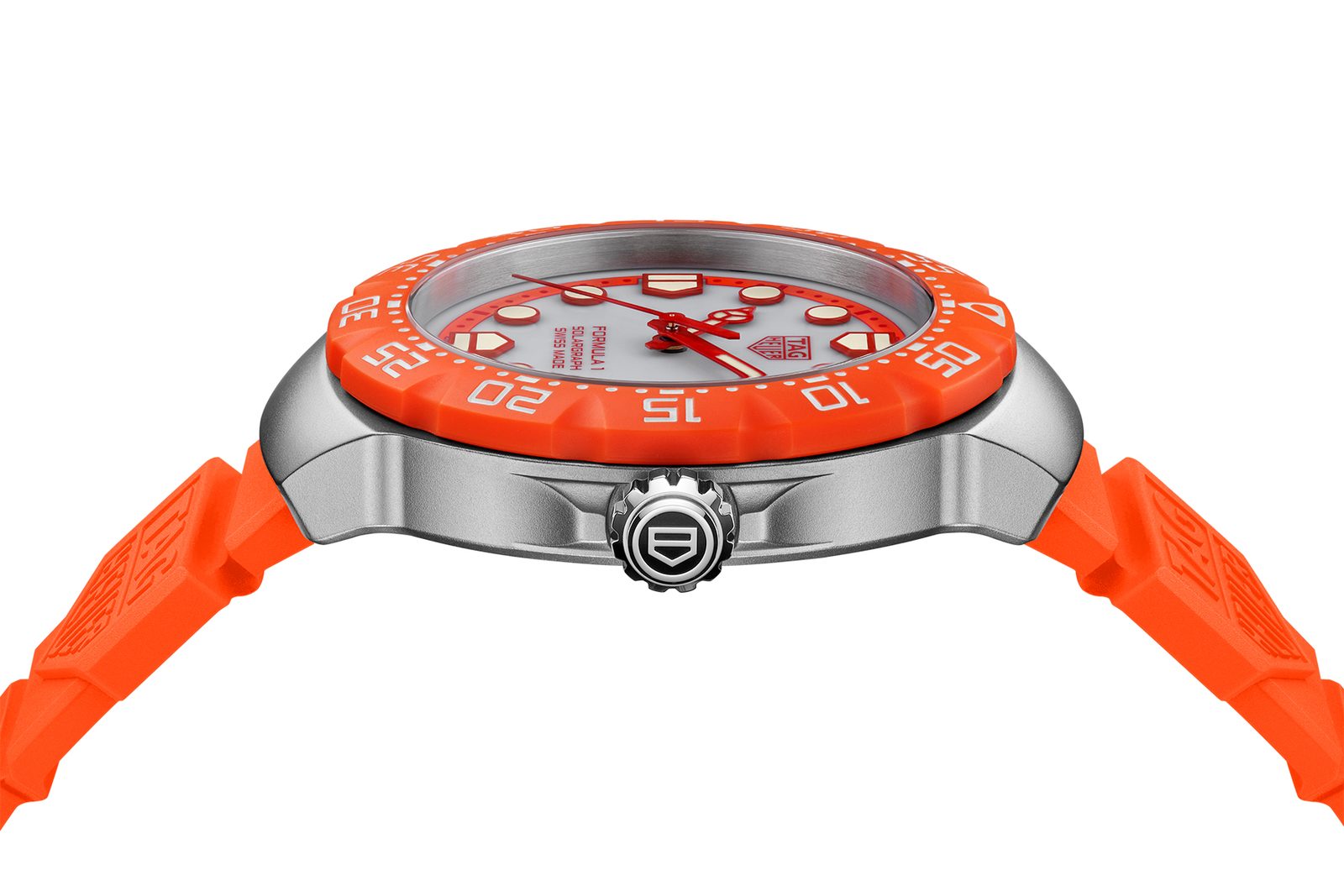 Side profile of the 38mm sandblasted steel case on an orange rubber strap, showing the knurled crown stamped with the TAG Heuer shield and the orange TH-Polylight bezel