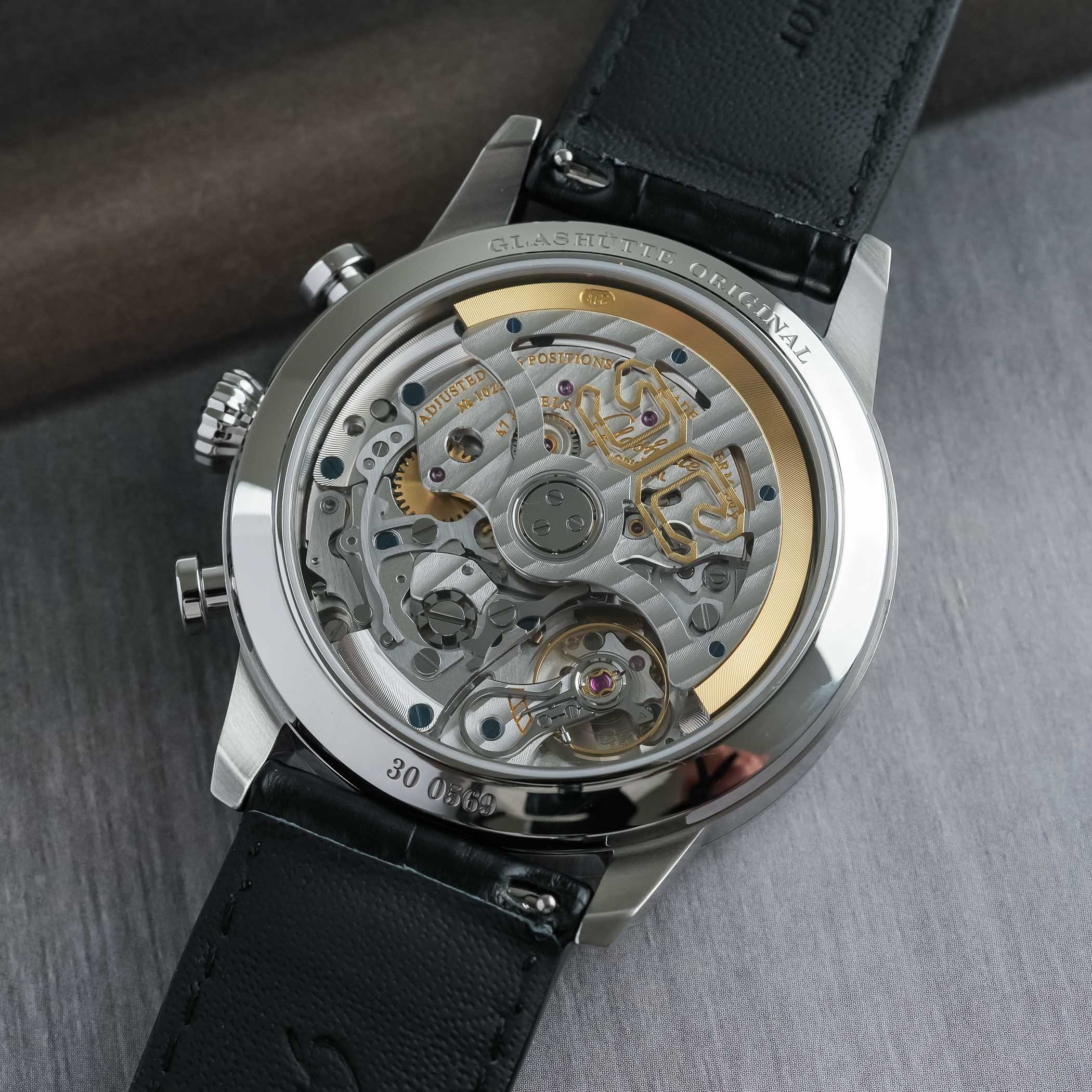 The sapphire caseback of the Senator Chronograph showing the Calibre 37-24, its three-quarter plate finished with Glashütte stripes, a skeletonised gold-rimmed rotor, swan-neck fine adjustment and blued screws, engraved Glashütte Original and 47 jewels