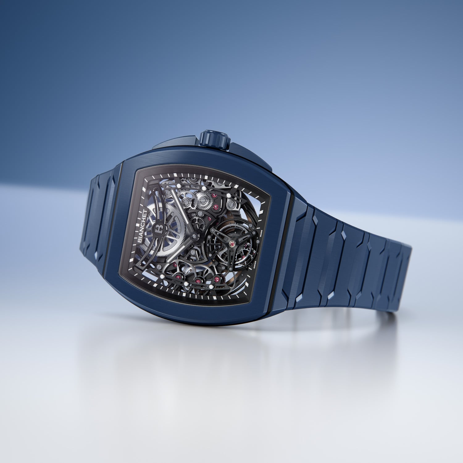 The deep blue Bianchet UltraFino Tonneau in profile, a blue high-tech ceramic tonneau case and integrated bracelet with a dark skeletonised movement and open flying tourbillon at six behind the sapphire