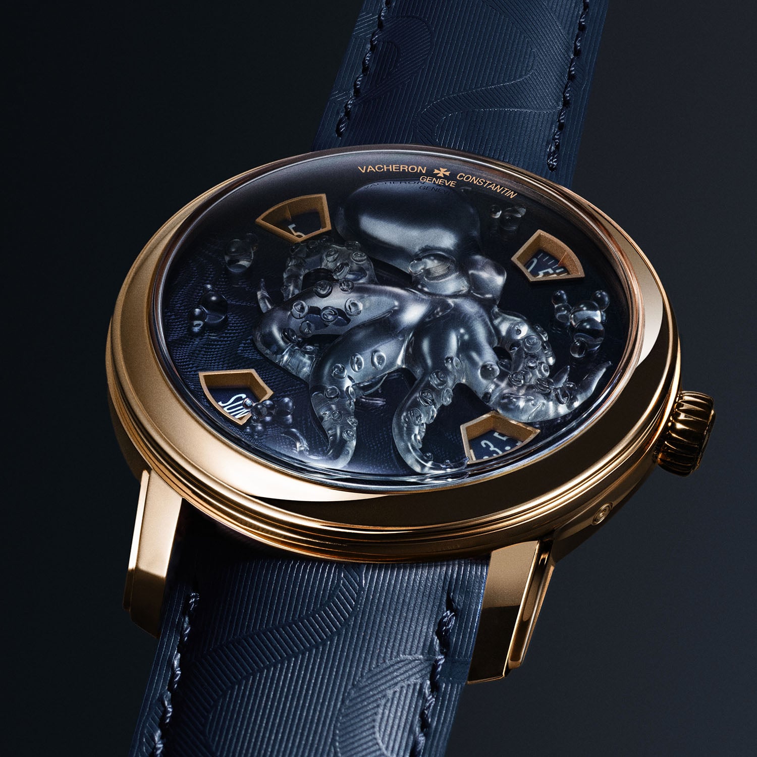 The Tigerbroidery dial of the Vacheron Constantin Métiers d'Art Tribute to the Animal Kingdom, a tiger's head worked in gold and dark embroidery thread among green embroidered foliage, in a white gold case with four aperture windows