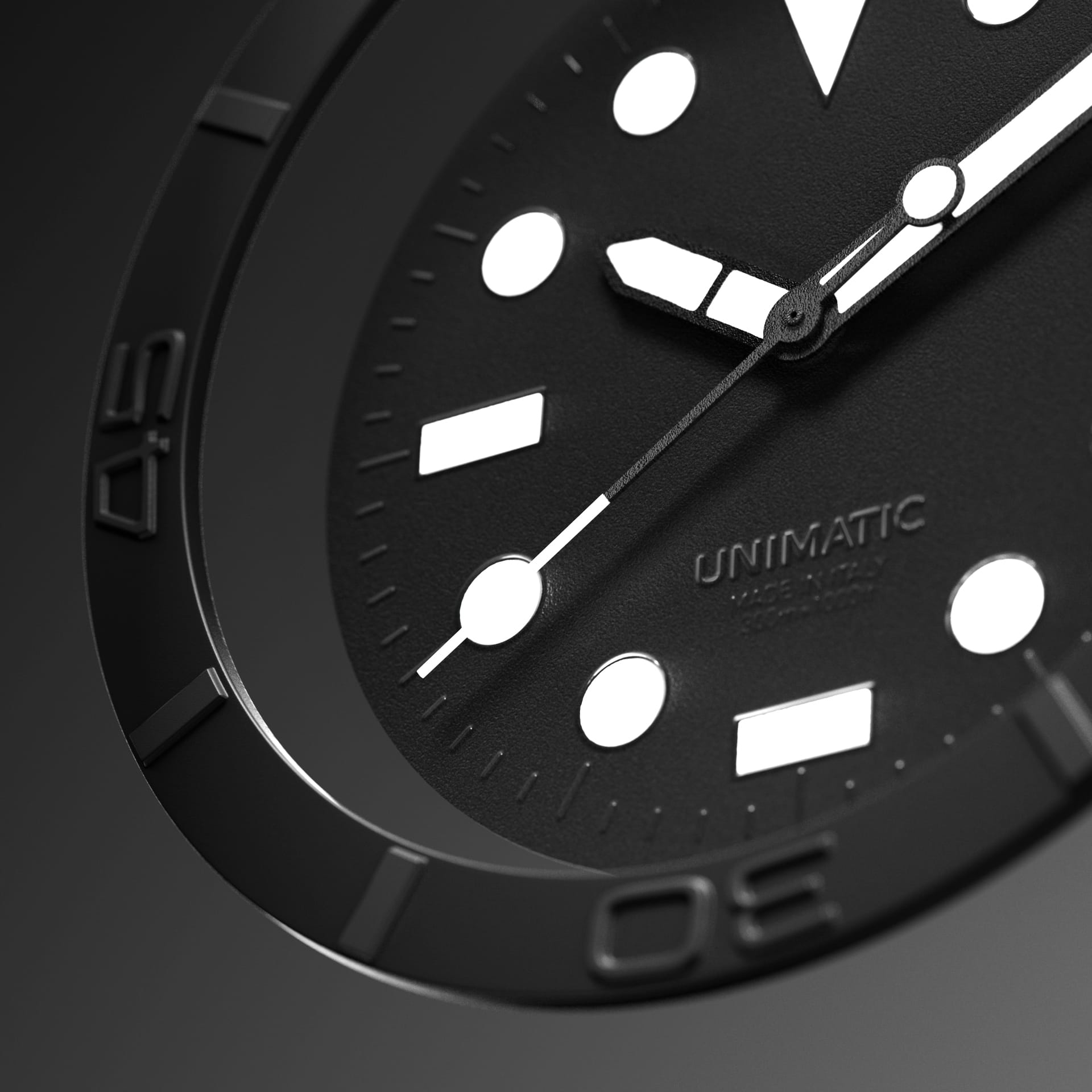 A macro of the matte-black Modello Uno U1-AEB dial, debossed Unimatic Made in Italy text and recessed markers in relief beneath a black bezel with sunken 30 and 45 numerals