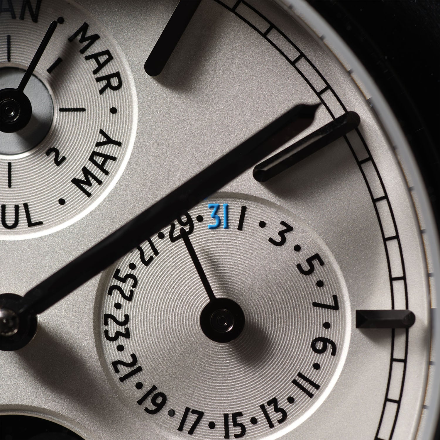 A macro of the Fears Brunswick 39 dial showing the date sub-dial with 31 picked out in blue and the in-house curved calendar numerals