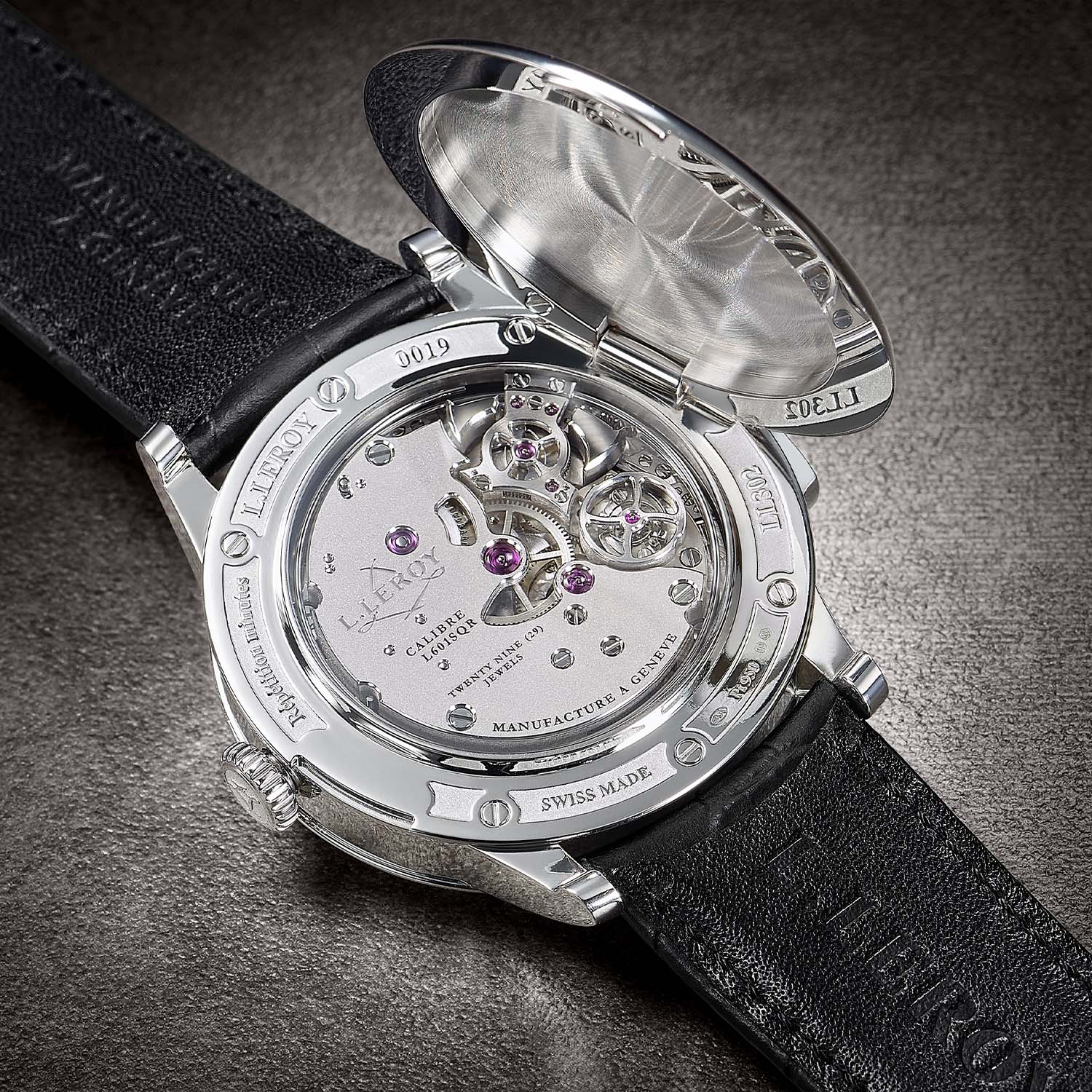 The hinged officer-style caseback of the L.Leroy Vox Temporis swung open to show the L601SQR movement, its flying tourbillon and engraved bridges