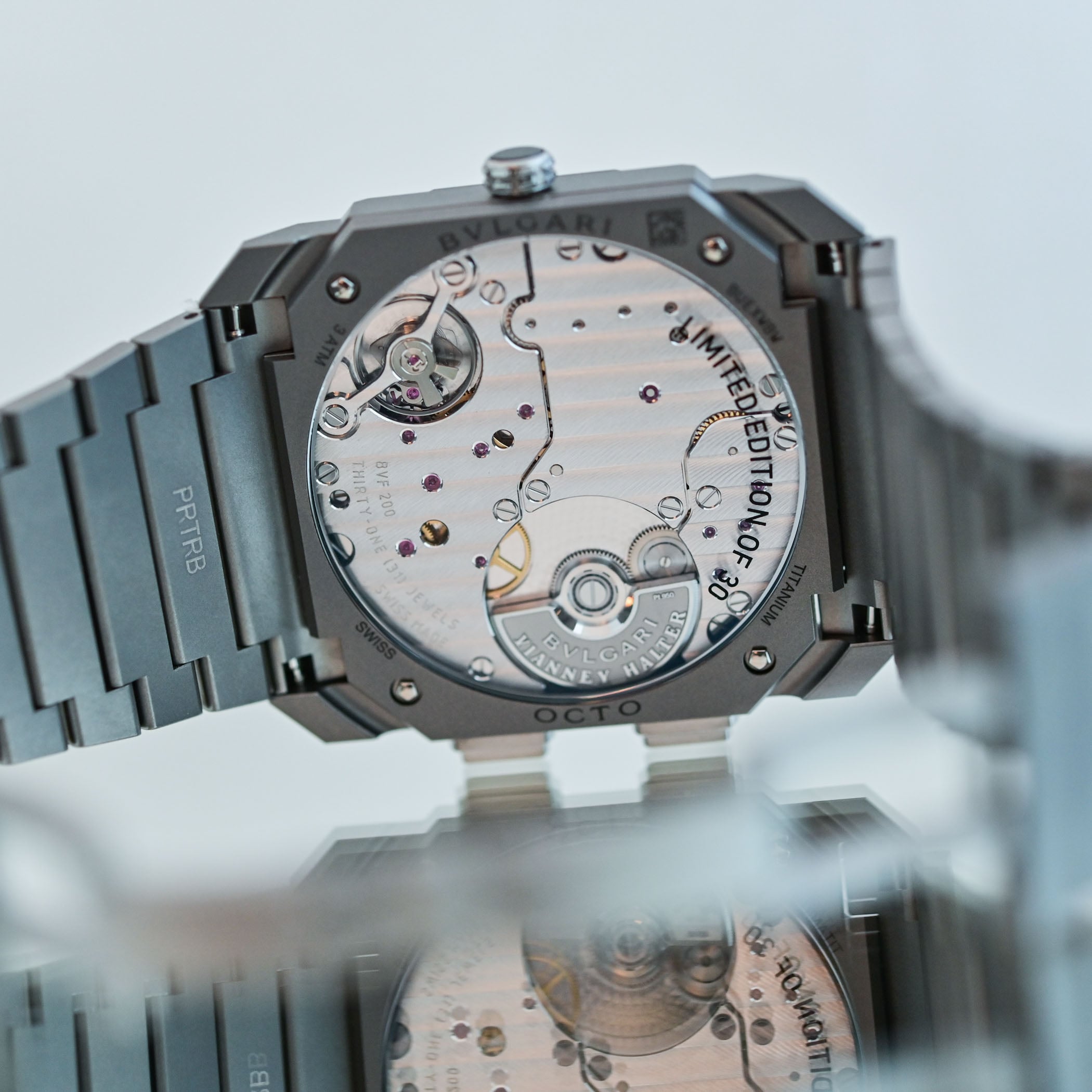 The sapphire caseback of the titanium version engraved LIMITED EDITION OF 30 and TITANIUM, showing the BVF 200 movement with vertical Cotes de Geneve and the platinum micro-rotor engraved BVLGARI VIANNEY HALTER