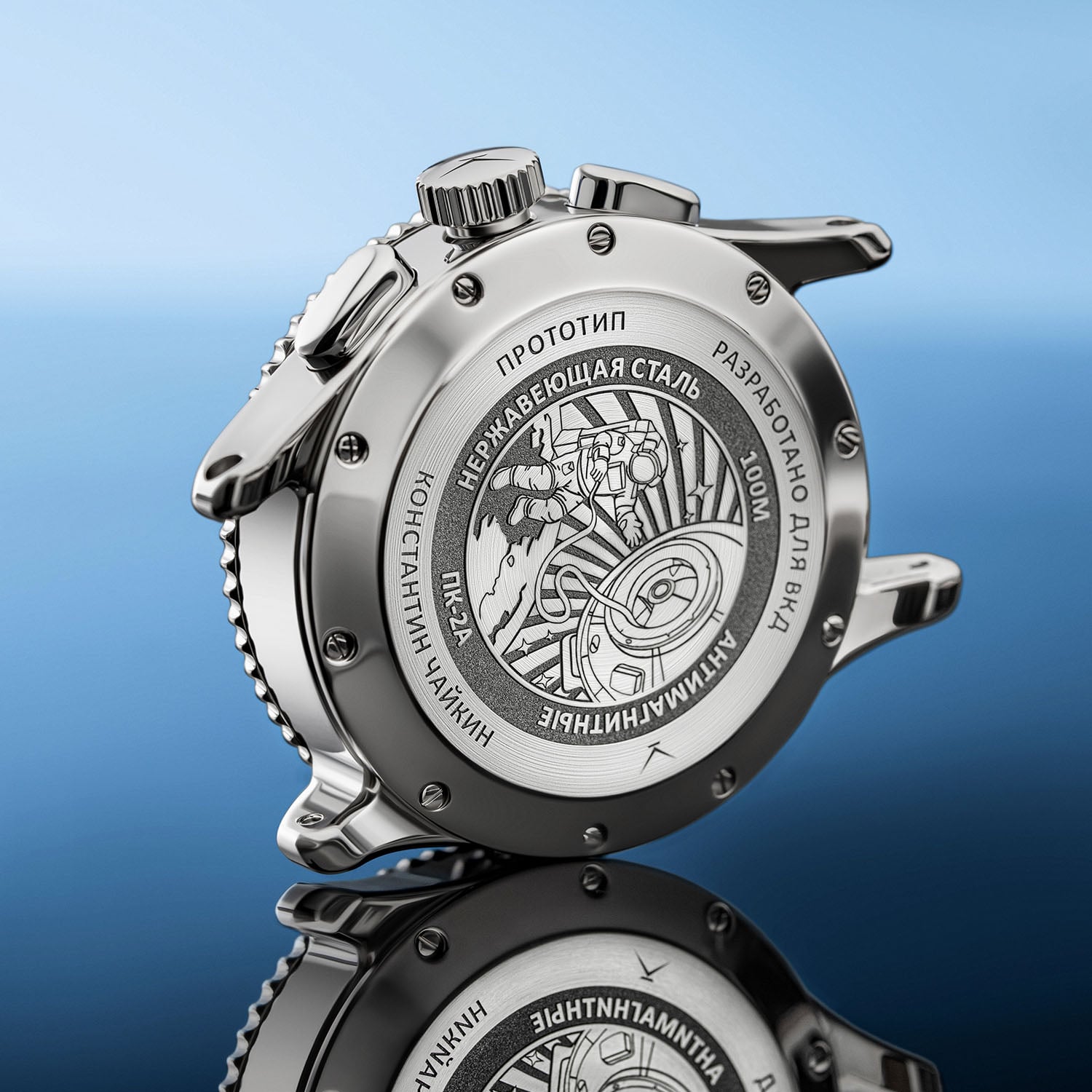 The solid steel caseback of the SC02C engraved with a cosmonaut on a spacewalk beside an orbital station, Cyrillic markings and a 100M rating, the case shown in profile with its two chronograph pushers and fluted crown