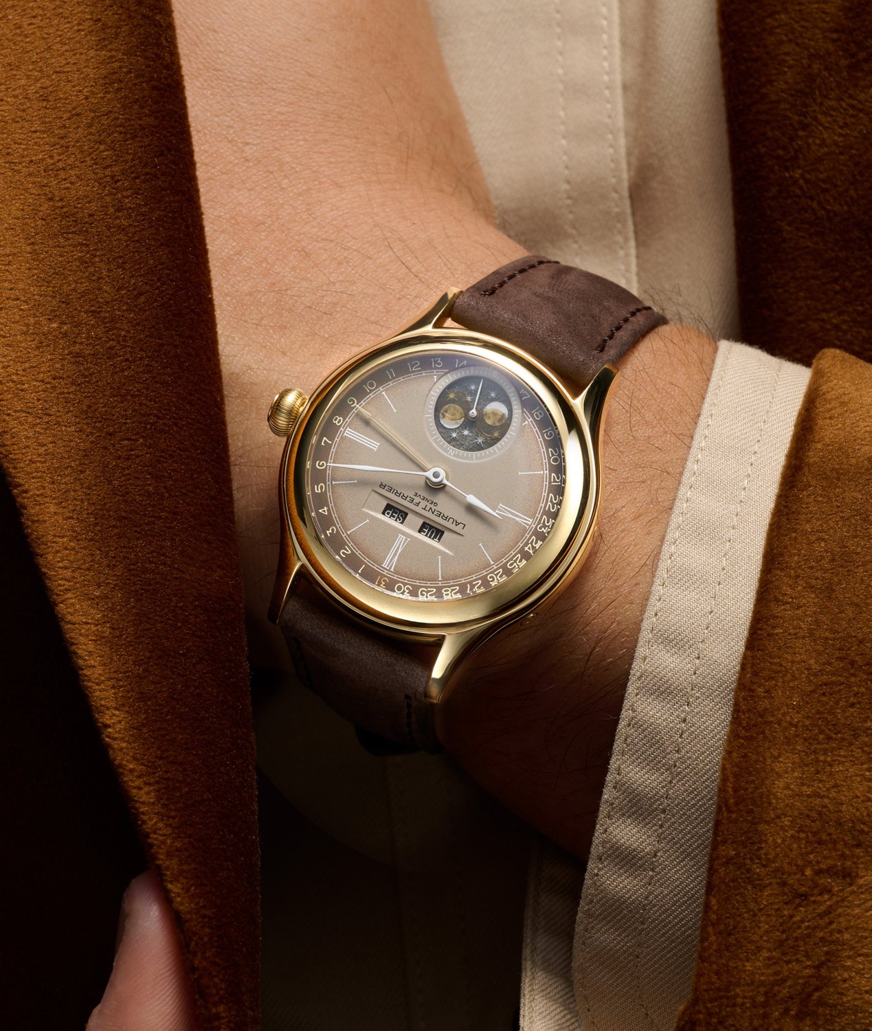 The yellow-gold Classic Moon Dusk on the wrist, the 40mm case on a warm brown strap