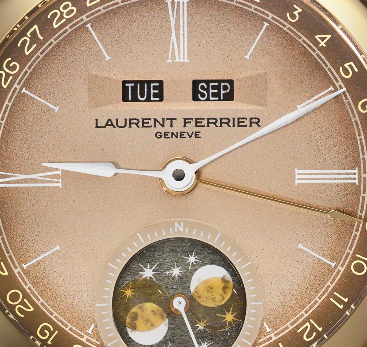 Dial detail: day and month apertures reading TUE and SEP below twelve, the peripheral date scale, and the anise-yellow enamel moonphase and stars at six