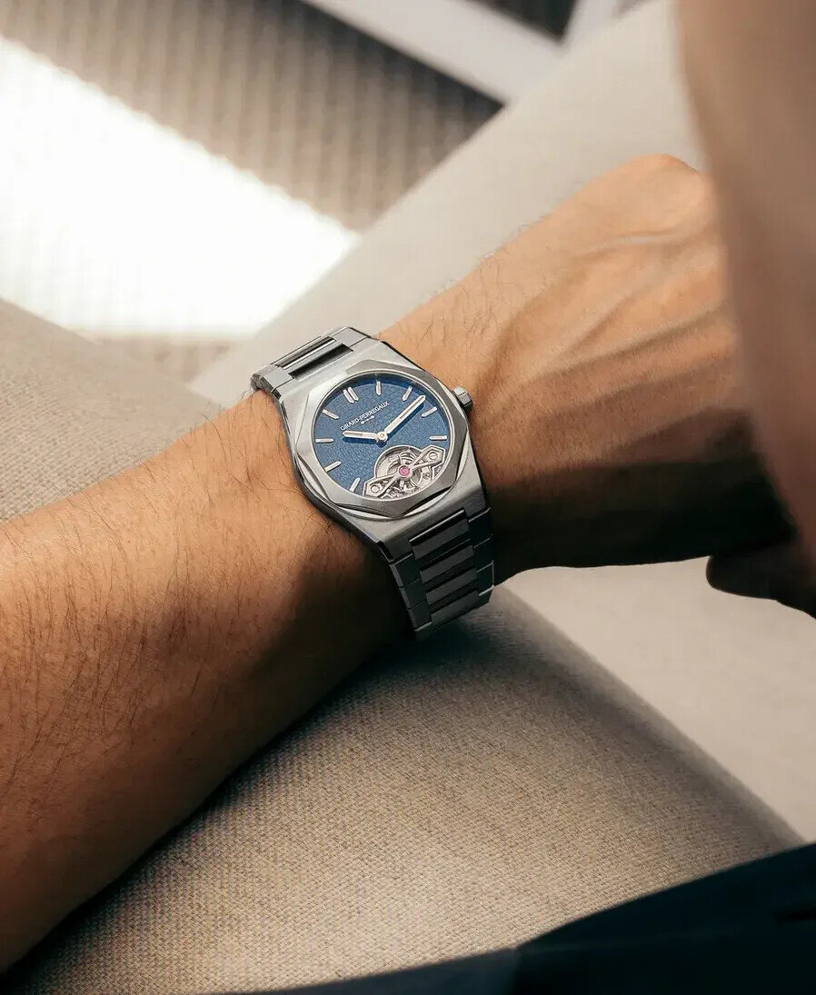The blue-enamel Laureato Fifty Tourbillon ref 99116-11-3528-1CM on the wrist, the tourbillon aperture at six and the octagonal bezel flowing into the integrated bracelet