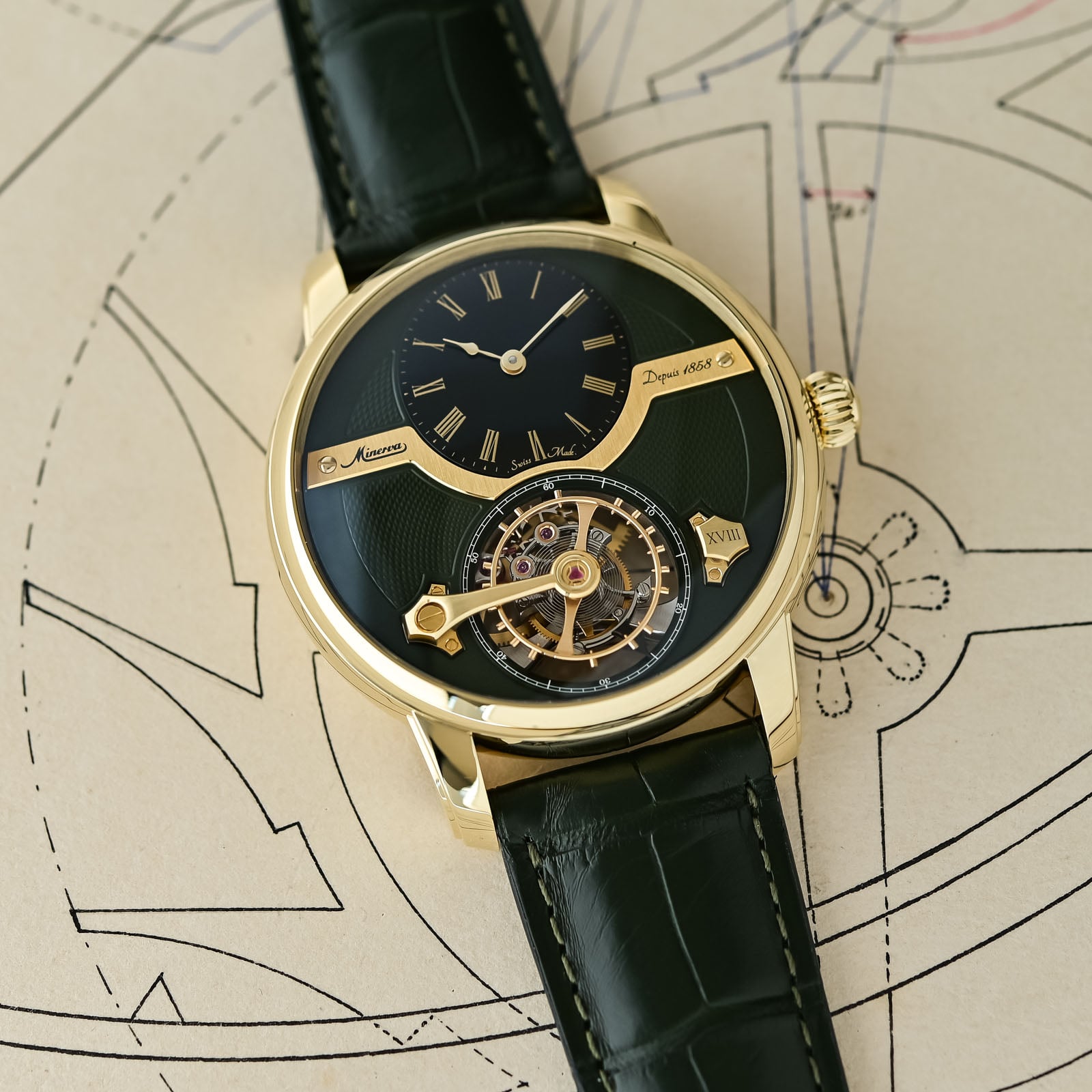 A close view of the off-centred black onyx hours-and-minutes dial in gold Roman numerals against the olive-green guilloche, next to the XVIII limited-edition marker